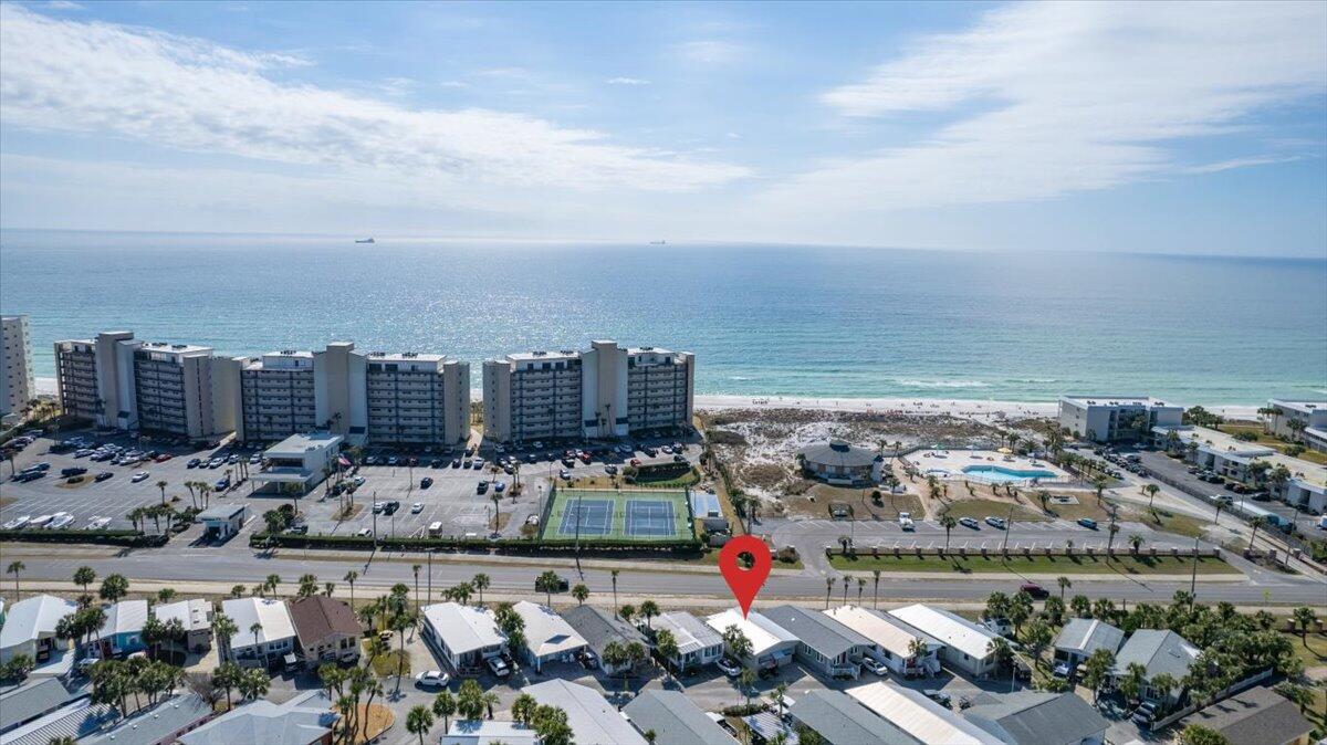 CURRENTLY UNDER CONTRACT, SELLER ACCEPTING BACKUP OFFERS. 72 hour kick out clause. Only accepting cash back up offers. Don't miss your opportunity to own premier location in Venture out with scenic views of the beach and venture out beachside pool. Ones on this side are rare to come available. The large back patio with expansive views features outdoor kitchen with built in grill. When head inside this 2 bedroom, 2 bath home has been totally remodeled. Open concept living, dining, and kitchen. Chef's kitchen features stainless appliances, oversize farmhouse sink, new cooktop/oven and custom designed vent hood. Don't miss your chance to own your piece of paradise. (property coming with golf cart!)