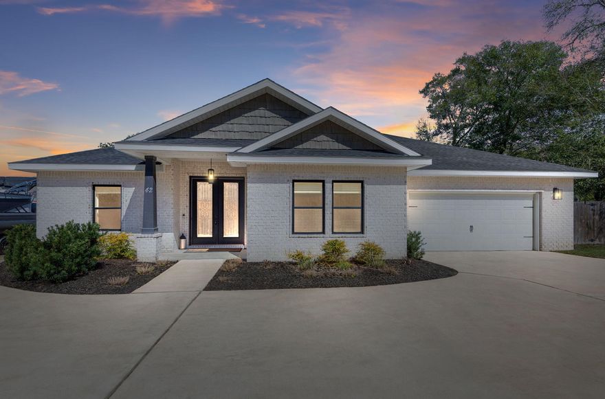 Dream Home in the highly sought after Poquito Bayou with no HOA on over 1/3 acre with a long private driveway. Enjoy your stunning oasis that features a sparkling pool with elegant waterfall accents, large paver pool deck, privacy fence raised garden beds and mature trees. Modern kitchen boasts quartz countertops, an island with a breakfast bar, ample cabinet storage, stainless appliances and plenty of  cooking space. Over 2800sf with an abundance of natural light, 4 bedrooms, 3 full bathrooms and versatile bonus room ideal for an office or playroom, plenty of space for everyone! Primary suite includes spa bathroom with soaking tub, separate shower, dual vanity and custom wood closet. Just minutes from a boat launch, top-rated schools, military bases and white sand beaches. Welcome Home!