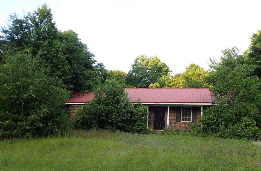 This Auction REO property was built in 1978. Home has all brick exterior, metal roof, and 1/2 acre chain linked back yard. Home has 3 bedrooms and 1 and 1/2 baths. Home is occupied, therefore home cannot be shown at this time. Do not trespass nor approach occupants. It is a criminal offense to trespass on occupied properties. Call today for additional information. Asking price is $56000.