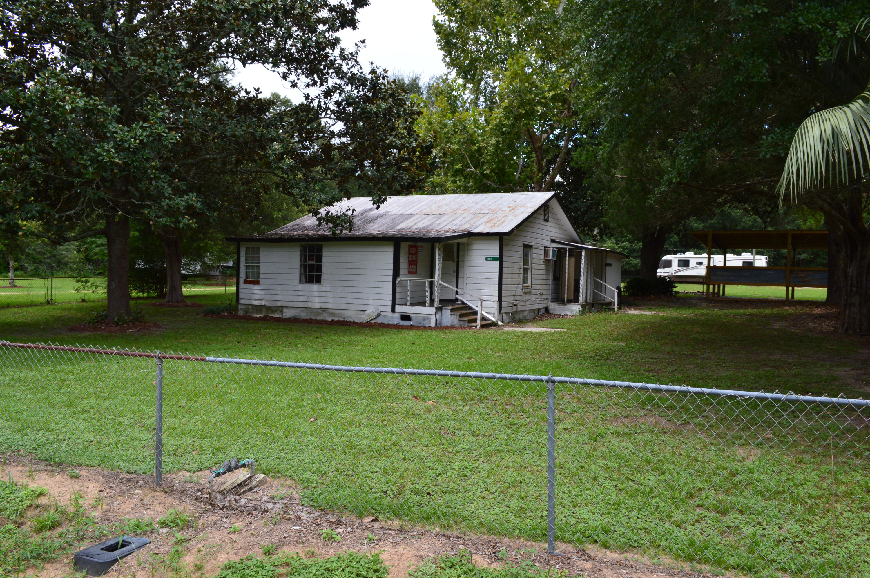 Northwest Defuniak Springs / King Lake area Home on 2 acres with 5 hookups (power, water, cleanout) for recreational vehicles. IRBY is renting month to month for RV, Work Boom Trucks, Work Trucks, Utility Trailers, and personal lineman and journeyman trucks. Plenty of room on site for large vehicles / work trucks. Large new fully enclosed work shop / garage with bay door and attached oversized two stall car port. The possibilities are endless with this one so call your favorite agent today for a look!