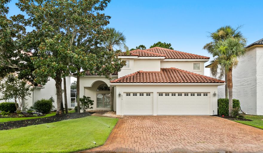 $20,000 towards buyer closing costs or price adjustment with accepted contract.  Golf course lot on the 18th tee box. Meticulously maintained and recently updated. Soaring two story family room and dining with custom railing and soaring hand-crafted ceilings. The open floor plan is perfect for entertaining and features custom plantation shutters, a wet bar, loft overlooking the main floor, and westerly views of the golf course and sunsets. Show off your chef skills in the upgraded kitchen with updated stainless appliances, granite countertops, raised breakfast bar and two pantry closets. The oversized first floor primary ensuite has doors leading to the patio and raised ceiling. Barn door leads to remodeled bath with large walk-in shower, free standing soaking tub and two separate vanities