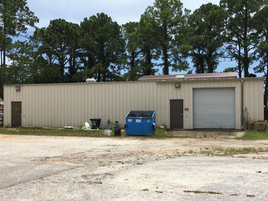 1.6 acres and 250 feet of road frontage on Hollywood Blvd. offers excellent visibility. This property is improved with two metal buildings: an 1,800 square foot building that is heated and cooled and a 1,400 square foot warehouse. The entire property is fenced.