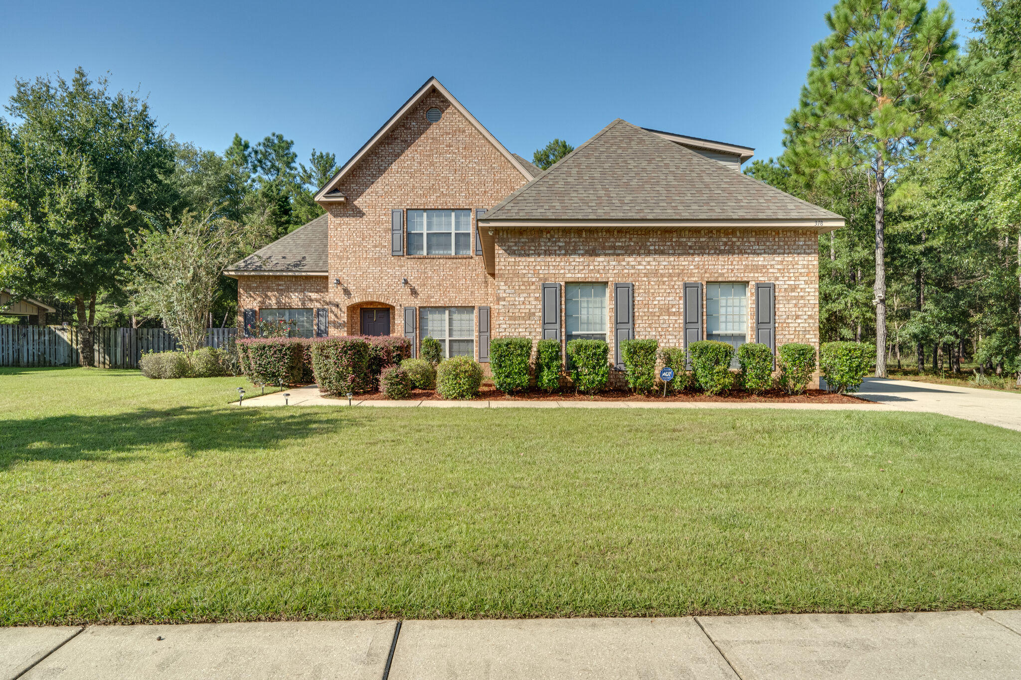 WOW! New Market Price Reduction and a MUST SEE! This magnificent 9yr old ALL brick home is ready for a new owner. Surrounded by nature and sitting in the beautiful quite community of Sounds, this Hammock Bay home is perfect with 5 beds and 3.5 baths. Enjoy the sounds of nature as you sit outside on the open patio or listen to your children play in the extra-large lot secured with a privacy fence. This home offers an office space for all of those working from home and extra built in shelving in the pantry for extra storage. No trouble with parking on this property as you enjoy a two car garage with an additional six parking places in the driveway. This home offers a full range security system giving you a piece of mind as your family snuggles up to watch a movie next to the fireplace.