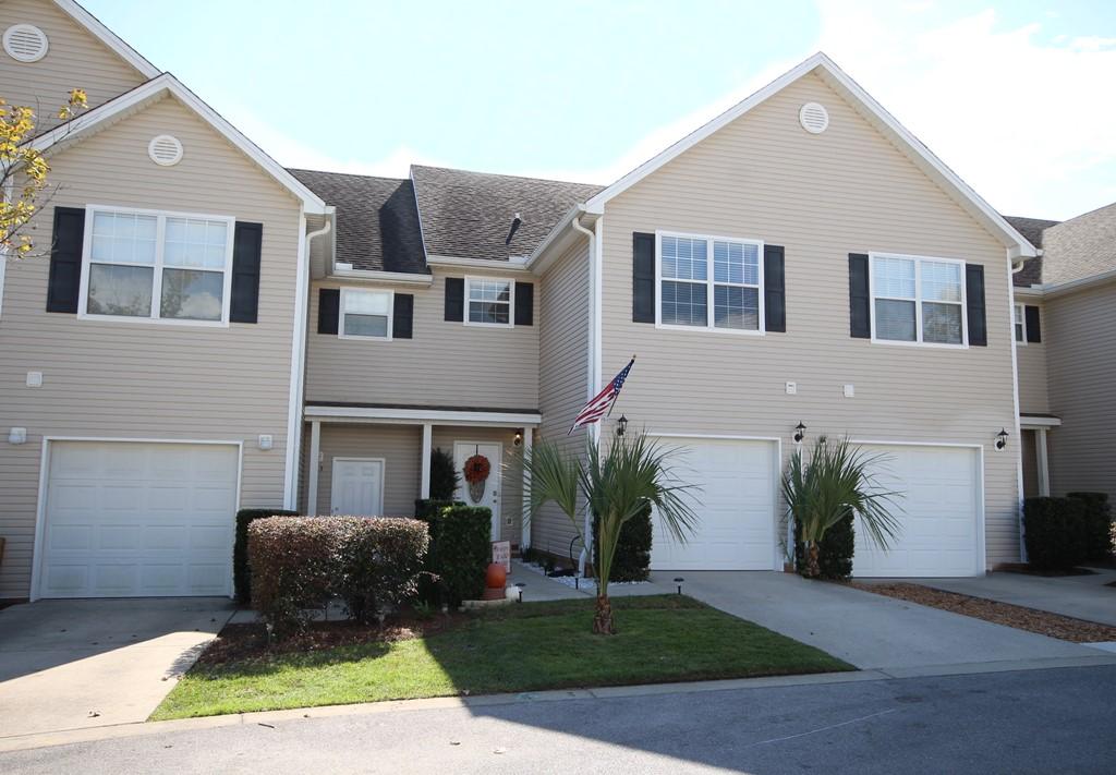 AFFORDABLE living in the center of Niceville close to schools and shopping! This 3 bedroom, 2.5 bath townhome with a 1-car garage is MOVE IN READY for you. The open floorplan allows for a casual lifestyle with the combined living/dining area open to the kitchen. The downstairs has wood laminate flooring for easy maintenance and the kitchen is well equipped with stainless appliances. The door from the living area leads to the back patio where you will find a built in grill, a HOT TUB and a fire pit area. All the bedrooms are upstairs along with the laundry room for easy access. The enormous master bedroom has enough space for a sitting area and the master bath features a soaking tub as well as a separate shower. The two additional upstairs bedrooms share another full bath. There is a 1-car