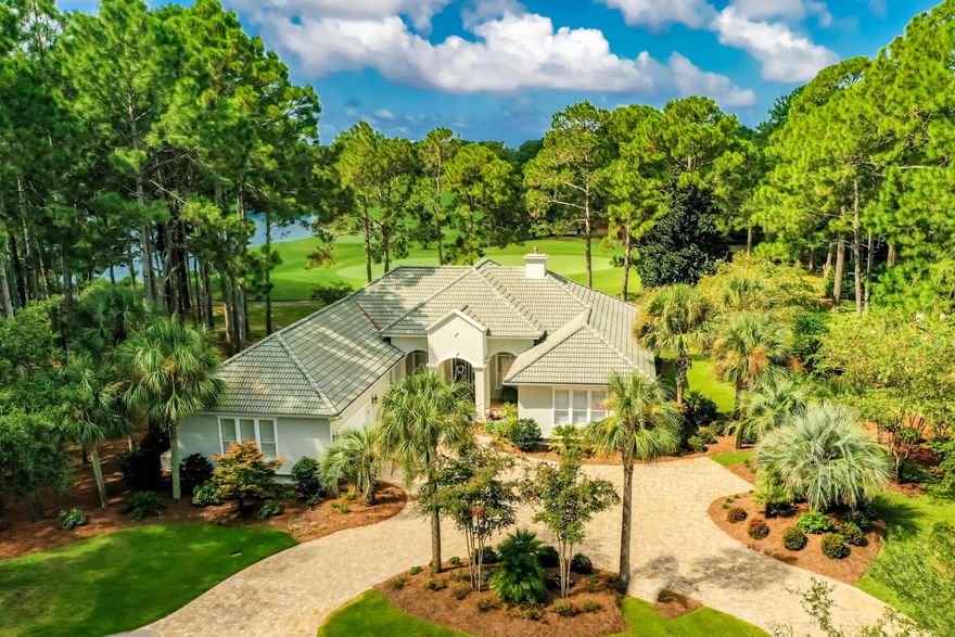 This spacious single level home is located on a prime golf course lot in the much sought after neighborhood of Island Green.  Featuring an open floor plan offering large living room with gas fireplace, dining room, kitchen, three large bedrooms, plus an office, two full baths and one half bath. The newly built screened pool has spectacular views of the Raven Golf course and a lake as does the large master bedroom suite with its beautifully updated bathroom featuring double vanities, free standing tub and large shower. The gourmet kitchen has all the amenities you would expect including a gas cook top, double wall oven, wine cooler, lots of custom cabinetry and counter/prep space.  New tile flooring throughout living areas,