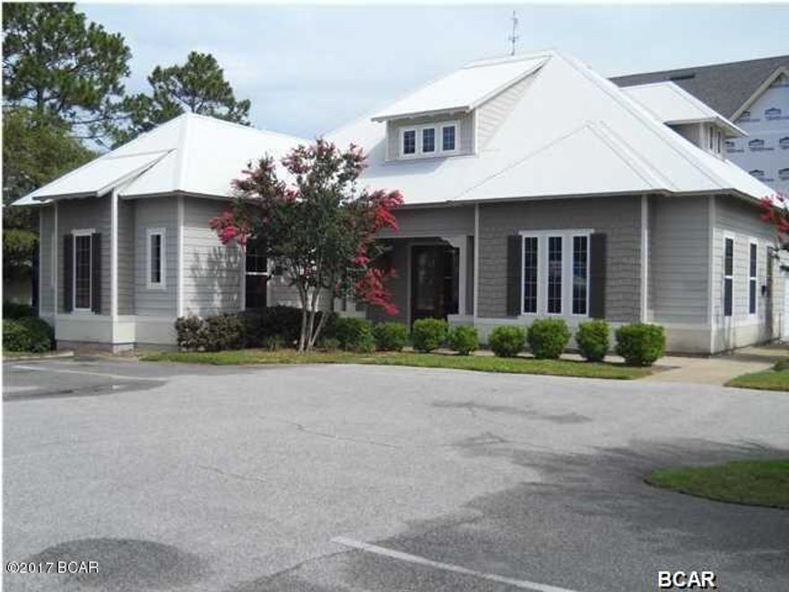 This high quality commercial office location is at the heart of Panama City Beach. This building is currently the offices of Edgewater General Contractors and is set-up and fully functional with reception area, private offices, stately conference room, restroom on main level with shower, kitchenette and 1- 1/2 garage for storage. There is also an 1100 sf separate office suite upstairs with private entrance, 1/2 bath and kitchenette with 3 private office areas. Everything here is finished with either stained concrete, tile or carpeted flooring. All built-in cabinetry and counters are top of the line materials. Easy to show, just call for an appointment.