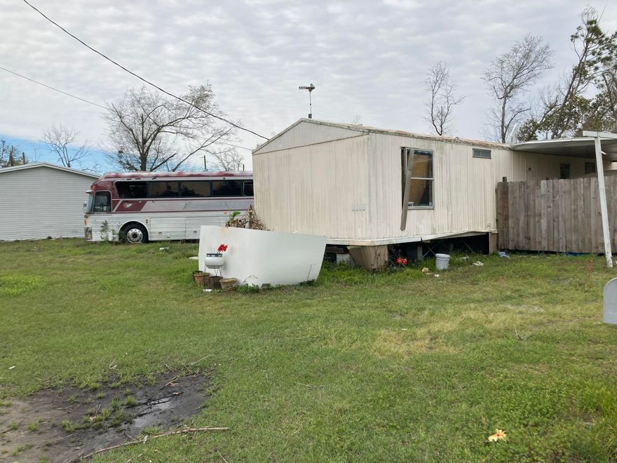 This double lot has recently gone through the probate process and is ready for new owners. It is large enough for two small homes or two manufactured homes.  Utilities are in place.  The Estate has an estimate for having both the current mobile home and tour bus removed from the property and will gladly share the quote with the new buyers.. The two structures on the property are not giving any value on the asking price.  This double parcel is priced to sell.  This property in conveniently located to everything Panama City has to offer and is ready for new owners or investors.
