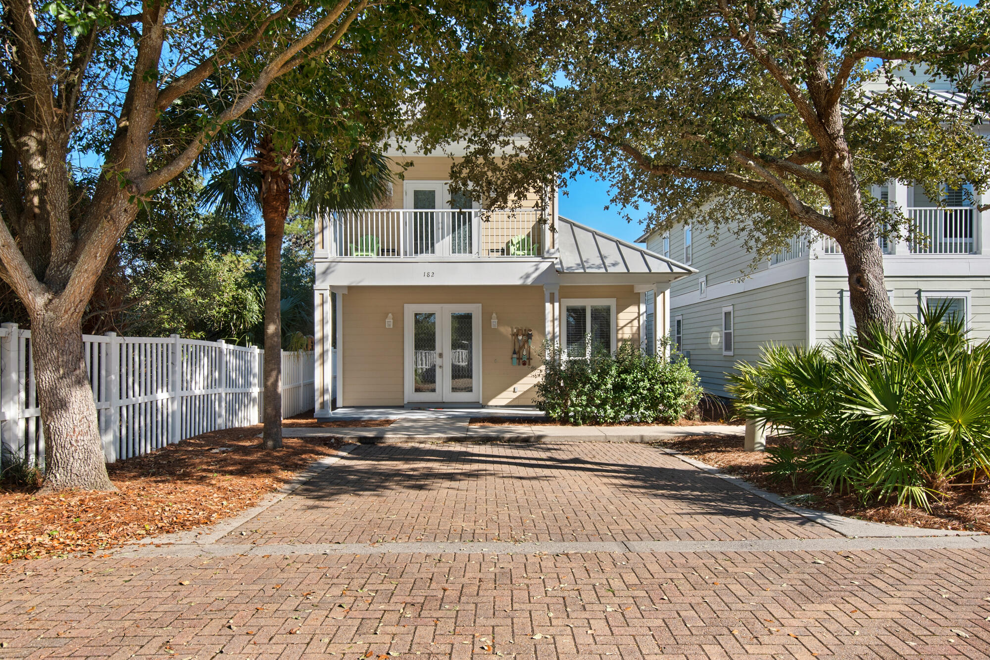 WELCOME TO YOUR COTTAGE RETREAT!Just a short distance to the beach and the 3000 Sq Ft heated pool with spa and sun deck. Gated community with brick paver streets and driveways. Underground utilities, access to the clubhouse with exercise facilities and 310 feet of white sandy beach. This unique home with an open floor plan features 3 bedrooms each having it's own private bathroom, silestone countertops, legacy cabinets, stainless steel appliances and 9' & 10' ceilings. You will love the tile floor throughout and covered porches. Home has a metal roof and hardy plank siding. Rental ready! HVAC replaced 12/24, Hot water heater replaced 2/24. All information to be verified by the purchaser.