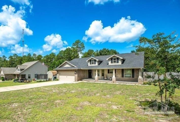Beautiful 3-bedroom, 2 full bath home, featuring a large covered front porch, two car garage, and a large front yard. The home has a gorgeous floating shelf that separates the living room and the dining room in this stunning open floor plan. The kitchen boasts a breakfast bar along with newer stainless appliances, moving on to the main bedroom you will find plenty of space, a dual vanity, a soaking tub, and a separate walk-in closet. The beautiful fully fenced backyard overlooks a natural preserve wooded area. Location allows for easy commute to Duke, Eglin, and Hurlburt! Available for move in on 1 June 2025. Don't wait, schedule your tour today!!