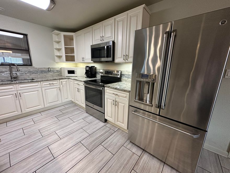 As you enter this brick home, notice the beautiful flooring and unique lighting throughout the home... The living room gives an abundance of sitting room perfect for gathering around the fire. This remodeled kitchen has plenty of cabinets, solid surface tops, a kitchen island, stainless steel appliances, and a built-in wine cooler.  The massive remodeled master bath has a huge walk-in tile shower, tile floors, and a double vanity. Man, the size of the master closet with added vanity!!! Fenced-in yard with an attached garage and bonus detached barn with double garage!Great Location with Easy access to the airport, Hwy 90 and Hwy 85. A short drive from local schools, a hospital, south Publix, various restaurants, and the upcoming Crestview Commons, Hwy 85, and I-10 are near the property