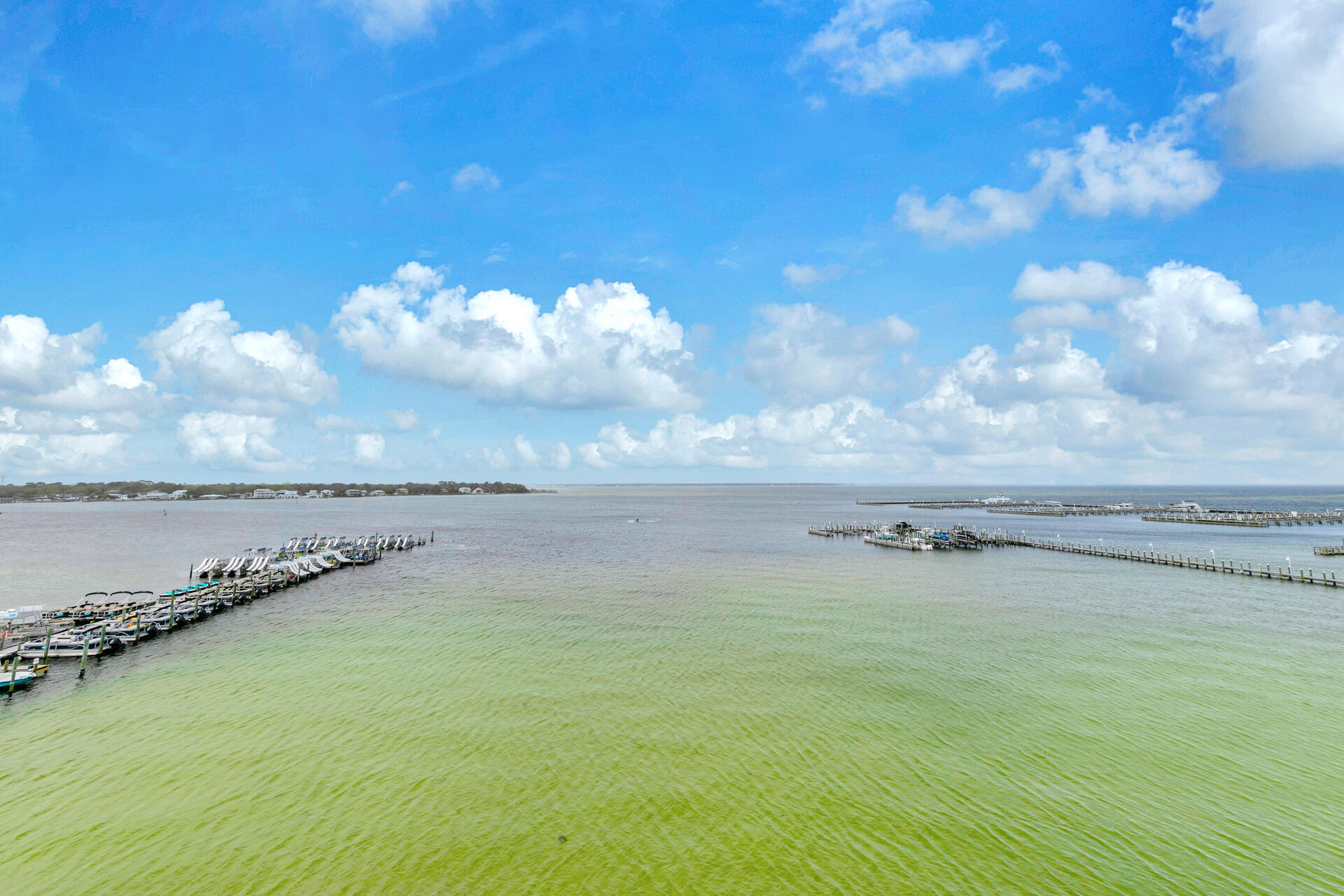 This amazing condo has outstanding views of the Choctawhatchee Bay from its large wrap around balcony and from most of the rooms. There is even a wet bar on the balcony. Updated and stylish decor including plantaion shutters.You can also access the beach via the pedestrian bridge. The 700' lazy river pool is very relaxing and there is also a Bayside Waterfall pool (heated seasonally ) , a Heron pool (heated seasonally) , a zero entry pool, along with a couple of pools on the Gulf side. Other great amenities include, 3 hot tubs, fitness center, grills , and more. Dock slips may be available for separate purchase. This condo has lots of room for the whole family, including a queen sized sleeper sofa and 2 rollaway twin beds. Sleeps up to 12 people. You can also take advatage of short rentals. Personal pictures and rental company items do not convey.