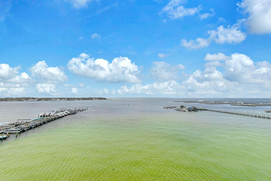 This amazing condo has outstanding views of the Choctawhatchee  Bay from its large wrap around balcony and from most of the rooms. There is even a wet bar on the balcony.  Updated and stylish decor including plantaion shutters.You can also access the beach via the pedestrian bridge. The 700' lazy river pool is very relaxing and there is also a Bayside Waterfall pool (heated seasonally ) , a Heron  pool (heated seasonally) , a zero entry pool, along with a couple of pools on the Gulf side.  Other great amenities include, 3 hot tubs, fitness center, grills , and more.  Dock slips may be available for separate purchase.  This condo has lots of room for the whole family, including a queen sized sleeper sofa and 2 rollaway twin beds. Sleeps up to 12 people. You can also take advatage of short rentals. Personal pictures and rental company items do not convey. 