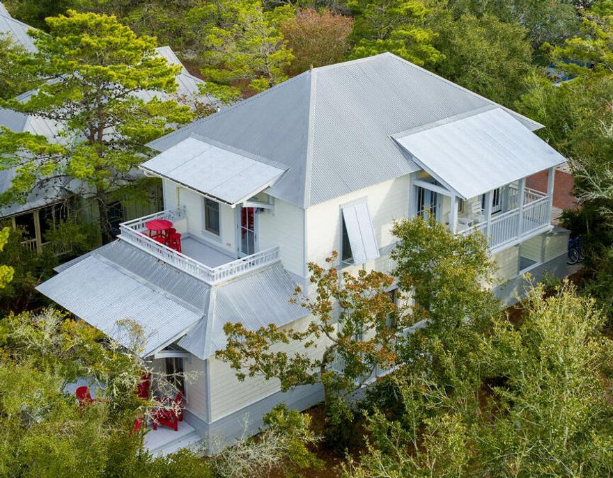 Welcome to this stunning beach home in Magnolia Cottages, nestled between Watersound and Alys Beach. Just steps from a deeded beach access and across from the community pool, this getaway promises comfort and relaxation. Unwind in two master suites with plush king beds, or enjoy privacy in the new queen-over-queen bunk room and built-in twin-over-twin bunks. Ascend to the second floor, where vaulted cypress ceilings in warm wood tones crown an open-concept living area perfect for gathering. Bright and breezy, this space encourages shared moments inside and out, with multiple porches and a modern kitchen with a spacious bar flows effortlessly into the dining area, creating a welcoming setting for family and friends.  Nearby dining, shopping, and endless coastal charm along Scenic 30A!