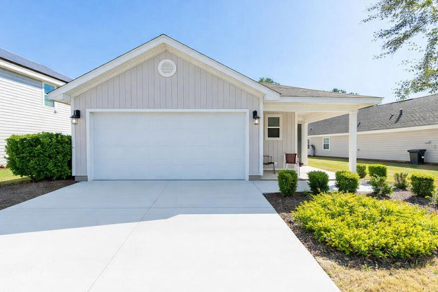 WOODED LOT !!  Whether you are a first time home buyer or ready for retirement to begin this is the perfect home for you. The HOA includes Landscaping Services, internet, Direct TV and all amenities at the three different Hammock Bay locations (Hammock Bay, Hammock Bay South, and Steamboat Landing). Consisting of a 25-meter lap pool, a resort-style pool, 2 fitness centers, basketball and pickleball courts, a playground, Just minutes from the beaches of South Walton, local shops, and top-rated schools. . Step inside to find an inviting open floor plan. The modern kitchen, featuring a stainless steel fridge and stove, a large island and pantry, and ample cabinetry (freshly painted in a coastal blue color with new hardware), flows into a spacious living area perfect for family gatherings or entertaining guests. New LVP flooring except for the Master Bathroom. 

The primary suite provides a peaceful retreat with a walk-in closet and a private en-suite shower with freshly painted cabinets, new mirrors and light fixtures. Additional bedrooms offer comfort and flexibility for guests, children, or a home office.
Enjoy Florida living at its finest. Relax on the covered porch, host BBQs, or simply enjoy the quiet setting of mature trees in your own backyard.

Additional highlights include a two-car garage with an included workbench. and proximity to Highway 20 and 331, providing quick access to Destin, Niceville, and the surrounding Gulf. Whether you're looking for your forever home or a peaceful getaway, 473 Earl Godwin Rd offers everything you need to live, work, and play in comfort.
