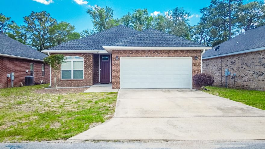 $250 off first month's rent. Welcome to 557 Valparaiso Parkway in beautiful Valparaiso, FL! This spacious 4-bedroom, 2-bath home offers 1,576 square feet of comfortable living, featuring stylish wood-look vinyl plank flooring throughout. The modern kitchen is equipped with stainless steel appliances, granite countertops, undermounted sinks, and rich dark wood cabinetry, all seamlessly connected to open-concept dining and living areas, perfect for entertaining. Enjoy added touches like a breakfast bar, ceiling fans, and recessed lighting throughout. The primary bath includes a dual vanity, and the fenced backyard is an outdoor retreat complete with a play structure, a paver patio, and a charming pergola for relaxing or hosting gatherings. Located just minutes from Eglin Air Force Base, this home also offers easy access to the white sand beaches of the Emerald Coast, the top-rated schools of Niceville, and family-friendly attractions such as Turkey Creek Nature Trail, Fred Gannon Rocky Bayou State Park, and the quaint shops and restaurants of downtown Niceville. Conveniently located for easy access to Crestview and Fort Walton Beach. 