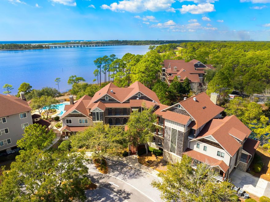 Imagine yourself at home in your quiet coastal sanctuary and view some of the most beautiful sunsets you have ever seen, right from your balcony!   You have found HOME in an OASIS in PARADISE.  This is Wild Heron!Come home to the most open floorplan three bedroom and one of the nicest in LAKESIDE LODGE.    INCREDIBLE UPGRADES beyond anything comparable.  Imagine coming home to relax on your covered porch to enjoy the beautiful water views and quiet that Lakeside Lodges can offer. Or relax in front of your electric fireplace and enjoy the beauty of your light and airy home. This gorgeous, remodeled home is a second floor, corner unit, with views of Lake Powell and full view of the peaceful pond adjacent to the building.  The sunsets are amazing!  Enjoy the craftsmanship that this home offers with hand crafted travertine floors, a complete modern kitchen remodel, new master bath remodel of cabinets, lighting, countertops and a soaker bathtub for those relaxing evenings.  Water Heater is new and there is a transferrable home warranty.  HVAC ducts and dryer ducts were cleaned and the whole home dehumidifier keeps you comfortable.  New track lighting in the living room , kitchen and hall provides amazing light.  A mounted gas grill on the balcony and ample seating provides for an amazing outdoor living experience.  

Lakeside Lodges are very well kept with new roofs, new gas and fire suppression systems, new elevator hydraulics, new gas lines, new swimming pool heater and more upgrades.  You are all set to enjoy living!  Wild Heron truly is a coastal sanctuary.  Amenities include a large, heated community pool, hot tub, large gym, boathouse, 28-boat boat-slip dock on Lake Powell - the second largest brackish lake in the world, fire pit, trails, event lawn, playground, and more.  Wild Heron is a very social neighborhood with summer concerts, holiday parties, weekly food trucks, yoga/dance exercise classes, and many other activities.  Watersound Club is available to join and includes not on the acclaimed Sharkstooth Gold club, but the brand-new Davis Love III course right out the back gate, Skeet shooting, Camp Creek gold, Camp Creek Inn, and Watersound beach club.  Sunsets on Lake Powell are incredible and fishing, boating, kayaking and paddleboarding are frequent activities.    You are only minutes to the gulf with Beach Access 87 right down Kelly Street.  
