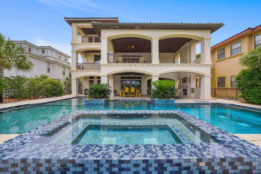 THE BEST IS YET TO COME with this Amazing Executive home situated on 78 ft. of lake frontage with tranquil lake views, and gorgeous Gulf views from the south-facing front of the home.  Every level of this three-story coastal beauty is perfectly planned to maximize relaxation, privacy, and enjoyment!  There are multiple terraces for viewing, dining or just kicking back to read a book, including a rooftop deck to enjoy the breathtaking sunrise and sunset views.  Located just steps away from the famous Gulf of Mexico white sandy beaches in the Crystal Beach area, and a short walk to the Crab Trap.  This well-designed floor plan offers 7 spacious bedrooms with en suite baths, 3 bunk rooms (total of 8 bunks) and a total of 8.5 baths.  Home will sleep 28 people.  The main gathering area is the