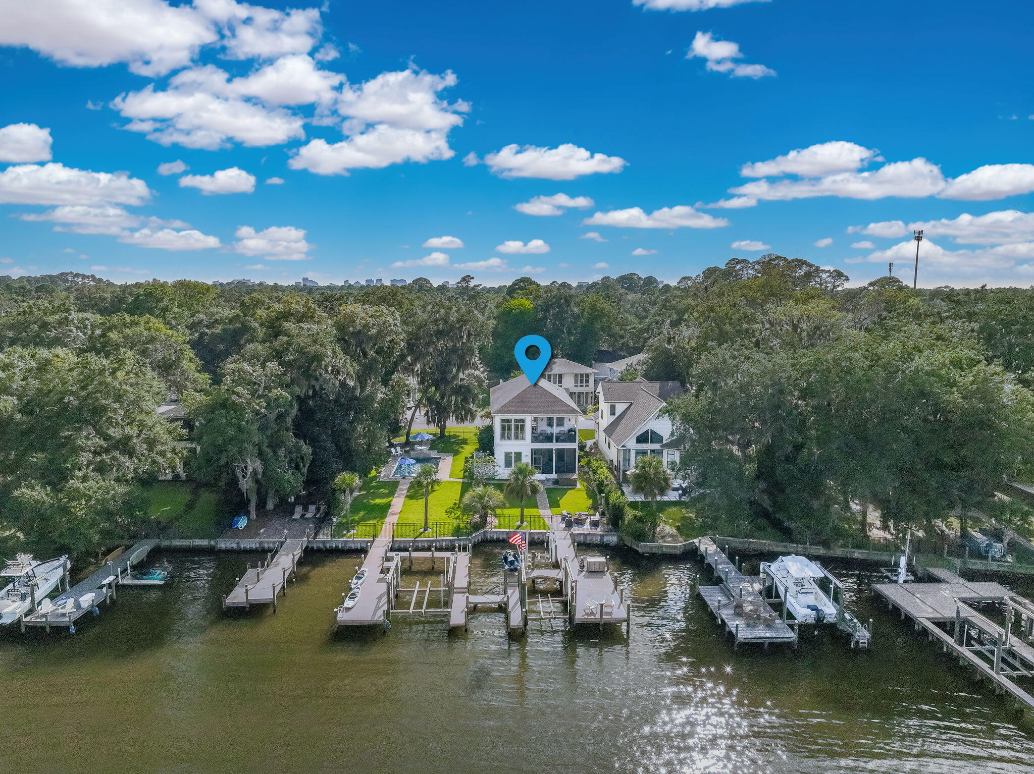 Nestled in the serene waterfront community of Sacred Oaks, this two-story home plus lot 20 offers unparalleled privacy with room to expand. With deepwater bayou frontage, two boat docks, a new swimming pool, and a four-person hot tub, this property captures the dream of Florida coastal living. From the moment you arrive, the Southern charm is undeniable, brick-paved streets shaded by moss-draped oaks, French gas lanterns at the entry, and sweeping views of the bayou that opens directly to the Choctawhatchee Bay. Dolphins, osprey, and pelicans are your daily companions in this serene natural setting. Inside, you'll find engineered wood floors throughout, an elevator for convenience, and thoughtfully updated features including expanded upper-level windows to frame the water views, and stylish barn doors in the master bath and laundry. The kitchen, appointed with granite countertops and modern appliances, flows into the living space so you can take in the panoramic water views while you cook. A hidden stairway leads to a spacious attic for storage. This home is fully equipped with natural gas (gas stove, pool heater, and tankless water heater), Culligan water treatment system, and modern smart-home conveniences: phone-controlled garage doors, front door lock, security system, temperature regulation, and cameras. Recently installed fiber optic internet by AT&T ensures fast, reliable connectivity. Outdoor living is where this property truly shines. Two private docks, both with lifts (currently handling a 34' Cobalt and a 24' outboard), feature new decking and even a drawbridge walkway between them. There are also two jet ski lifts, a brand-new seawall, full-property irrigation system, and a newly fenced pool area with extensive paver walkways.
Highlights include:
-Two waterfront lots totaling rare bayou frontage
-Two docks with boat lifts + two jet ski lifts
-Brand-new swimming pool + hot tub
-Elevator + hidden attic access
-Natural gas throughout home
-New seawall, irrigation system, fencing, and exterior decking
-Smart-home features for security and convenience
-Close to white sand beaches, Sacred Heart Hospital, Grand
Boulevard dining & shopping, and A+ rated schools
This property is the perfect blend of classic Southern charm and modern coastal luxury.