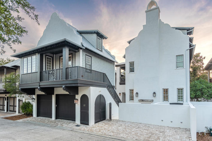 Offering a desirable location just south of Scenic Highway 30A, this exquisite estate has been thoughtfully designed to provide a luxurious coastal lifestyle in the heart of Rosemary Beach. Completed in 2019, this masterfully-designed home was constructed out of solid concrete and provides 4,706 square feet of living space. Open and spacious, first-floor living areas offer elegant finishes that include custom tile work and peacock paver flooring. The great room commands attention with its exposed wood beams and Venetian accent fireplace, while the gourmet kitchen provides an inspiring place to prepare meals with its custom cabinetry, quartz countertops, and environmentally-conscious Italian Bertazzoni appliances.