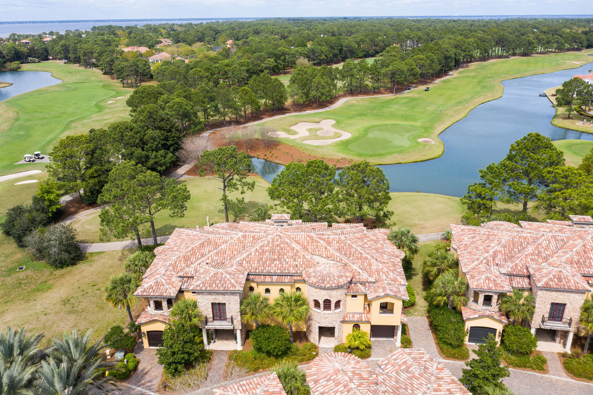 New Tuscana Community Pool Coming soon with 3136 sq. ft., 4 Bedrooms, 3.5 baths garage AND parking pad being sold completely furnished and ready for your enjoyment! Entertain in the Living/Dining area with stone gas fireplace and French Doors leading to the outdoor entertainment area with a covered patio and fire pit overlooking the lake and golf course. The open kitchen offers a breakfast bar, Sub-Zero Refrigerator, Viking appliances, 2 copper sinks, island, pantry, and beautiful tile backsplash. Wine lovers will be delighted the wine room with refrigerator and storage off of the grand foyer. The spacious and luxurious Master Suite has a beamed ceiling, sitting area, see-through gas fireplace and french doors to the balcony with a beautiful lake and golf course views and huge master b The Master Bath has dual vanities, large round soaking tub, separate shower, another vanity for makeup, separate water closet. The guest suite which was an addition, also has its own private bath, walk in closet, gas fireplace and balcony access with beautiful lake and golf course views. The 3rd bedroom also has it's own balcony. The office, laundry and a full bath complete the 2nd level and a powder room with a Japanese toilet completes the main floor. This property has some unique features including a whole house generator and extra parking pad in addition to the single car garage. This magnificent property is located on the 12th hole of the Raven Golf Course and near all the dining and entertainment options in the Village of Baytowne. Sandestin Golf and Beach Resort is a major destination for all seasons and all ages, and has been named the #1 resort on Florida's Emerald Coast. This magical resort spanning over 2,000 acres is comprised of over 70 unique neighborhoods of condominiums, villas, town homes, and estates. The resort features miles of sandy white beaches and pristine bay front, four championship golf courses, a world-class tennis center with 15 courts, 4 resort swimming pools (and 15 private neighborhood pools), a 123-slip marina, a fully equipped and professionally staffed fitness center and spa, meeting spaces and The Village of Baytowne Wharf, a charming pedestrian village with events, shopping, dining, family entertainment and nightlife. For true golf cart community living, Grand Boulevard is just outside the resort gates and provides access to additional shopping, dining and entertainment; all without traveling on Hwy. 98.