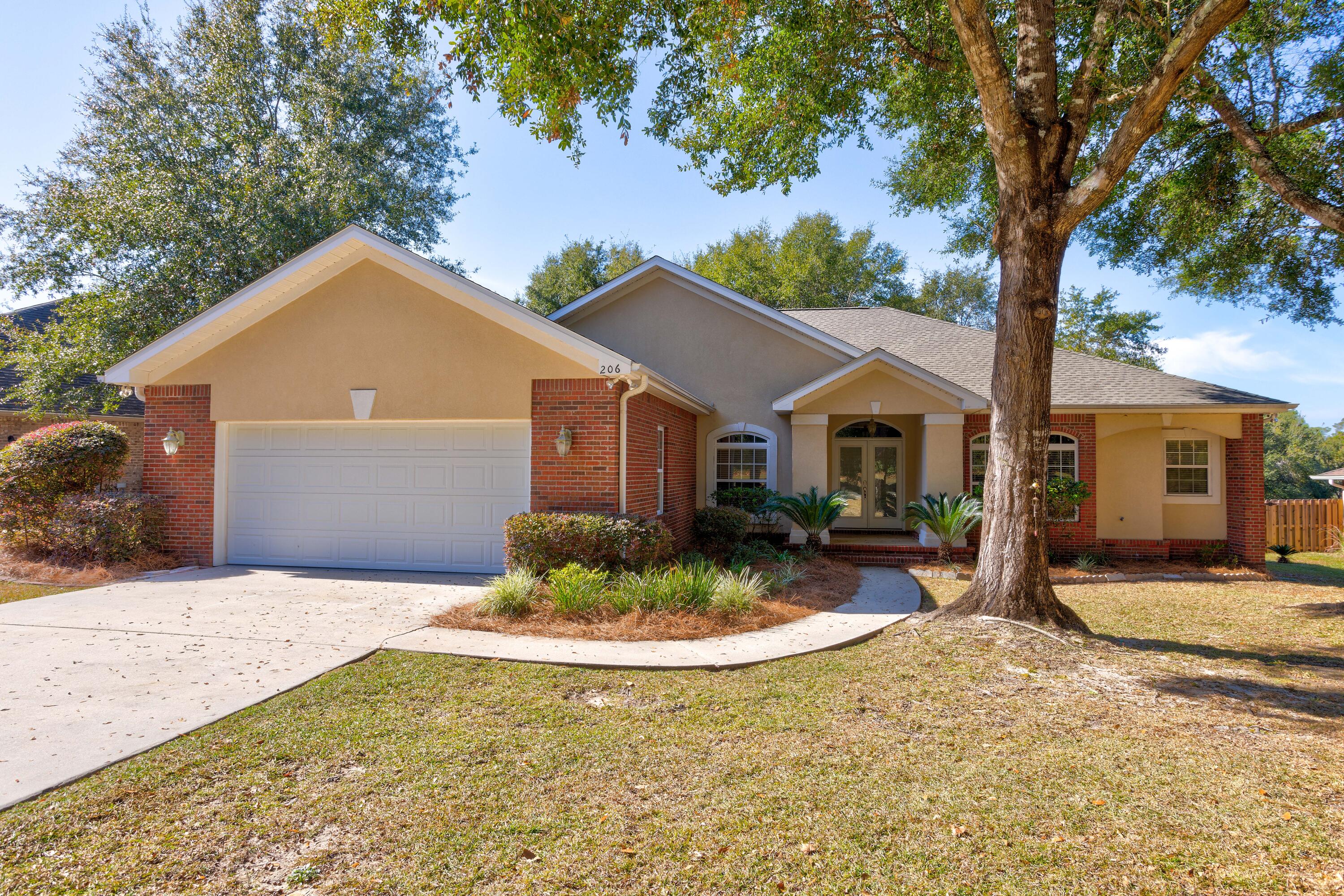 Back on the market, no fault of the sellers! Beautiful Custom Built Home complete with built-in display cabinets in kitchen along with stainless steel appliances and corian counter tops. Hardwood floors in foyer, living room, formal dining room and hallway. Ceramic tile in hall bath and 1/2 bath. Marble floor in master bath. New carpet in three bedrooms. Fourth bedroom could double as studio/office. Fully enclosed porch. Beautiful custom cabinetry throughout the home. Heating and cooling systems are located in garage for noise reduction. Sprinkler system has a separate meter installed. New Roof Nov,2021,Window glass to be replaced. Fenced back yard. Transferable termite bond. Buyer to verify all pertinent information