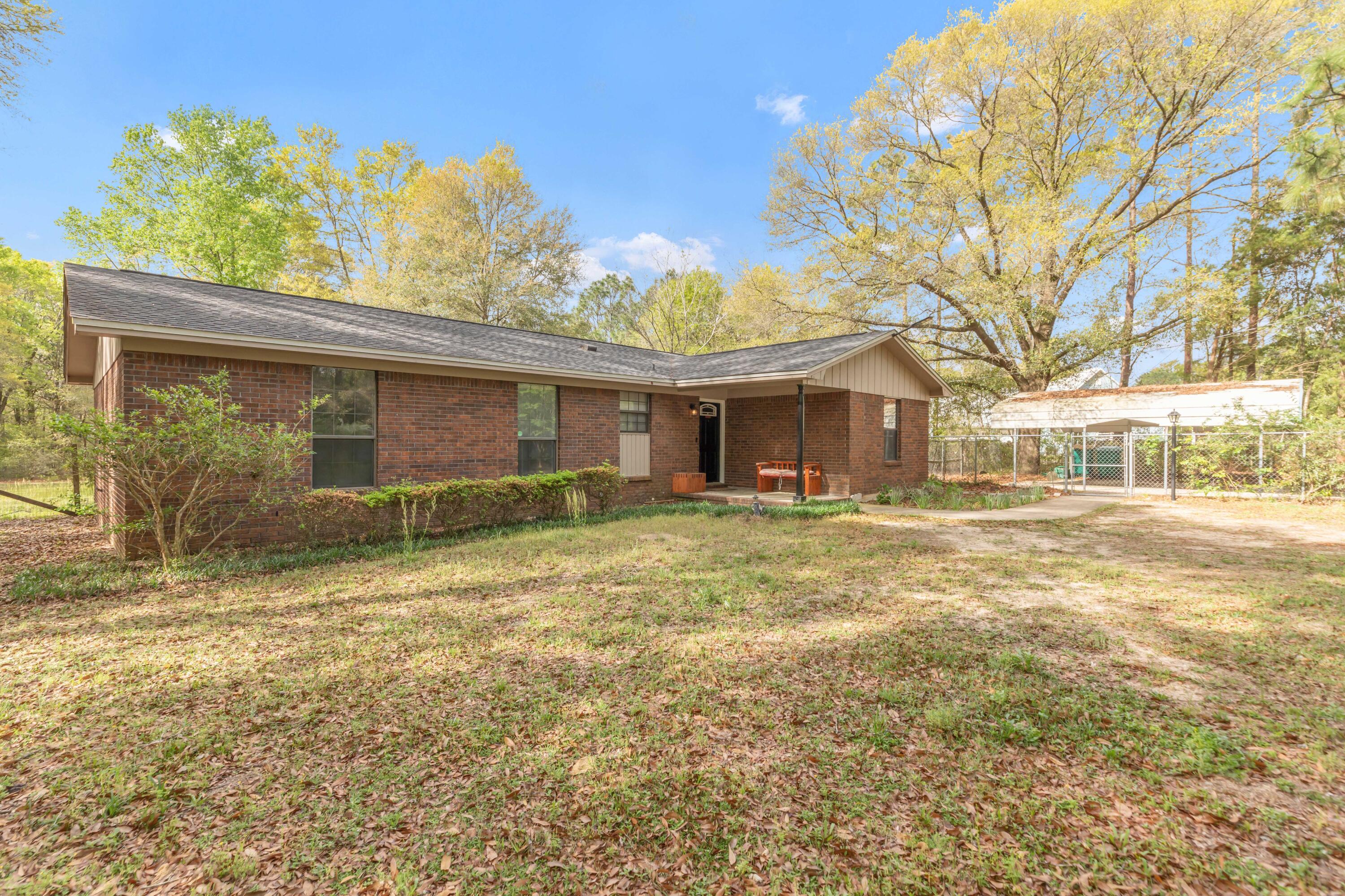 NO HOA - COUNTY TAXES - 4 BEDROOM AND 3 BATH HOME ON 1.25 ACRES ON OLD BETHEL RD IN CRESTVIEW!!!Tucked away behind mature trees and blooming azaleas, you will find this well maintained home featuring tile and luxury vinyl plank flooring throughout. Updated kitchen with loads of cabinets and granite countertops with complimentary stainless steel appliances. Split bedroom design for added privacy. Newer roof and HVAC system along with two hot water heaters and two septic systems. All of this on 1.25 acres of level land with mature trees and flowering landscape. Don't miss out on this find in the heart of west Crestview.