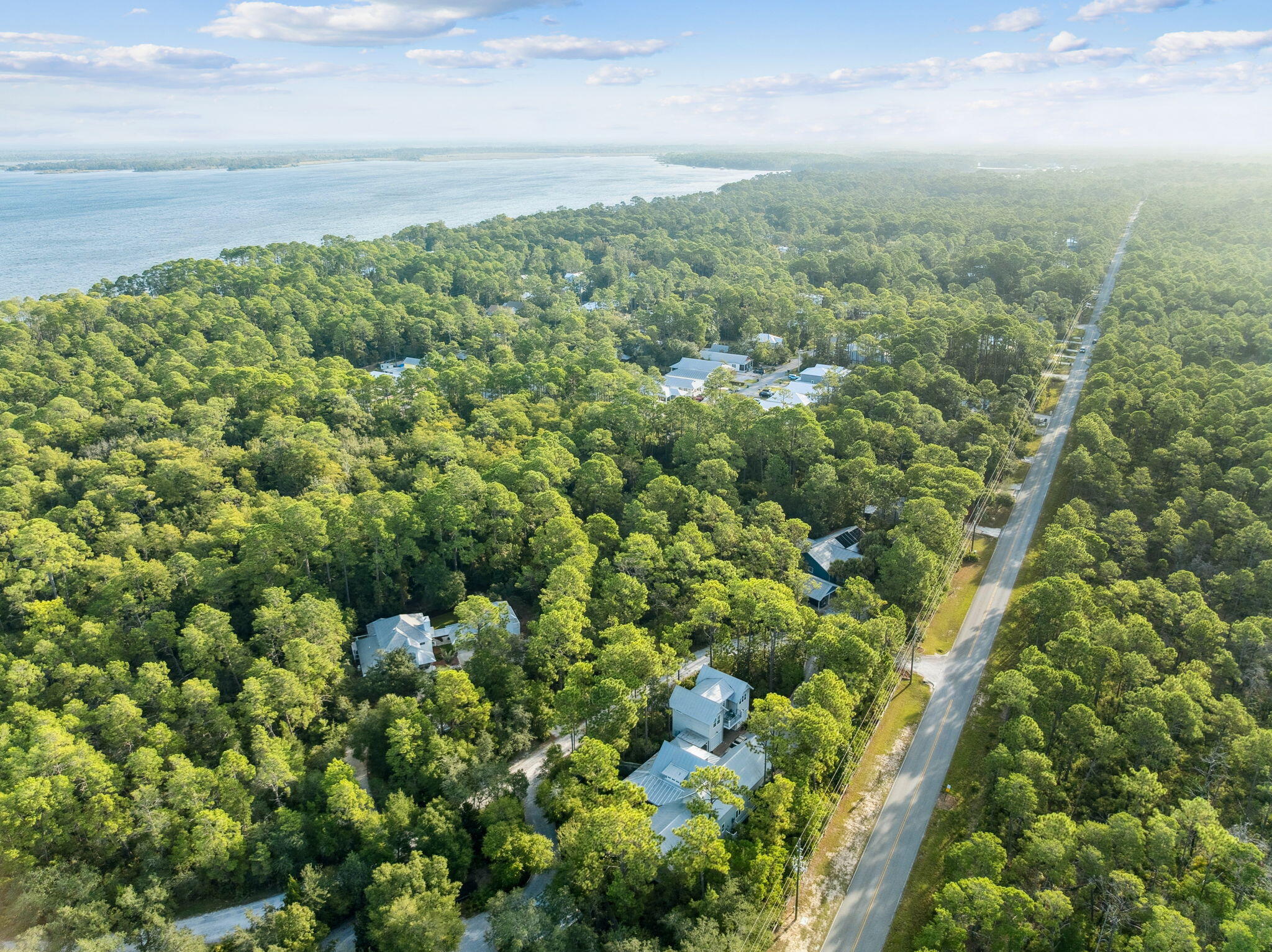 Build your dream home on this spacious 1.12-acre lot in the desirable Bay Magnolia neighborhood of Point Washington. Surrounded by mature trees, this oversized parcel offers privacy and room for outdoor living. Bay Magnolia features a community dock perfect for enjoying sunsets on the Choctawhatchee Bay. Tucked in a quiet setting yet only minutes from Scenic 30A's beaches, dining, and shopping, this homesite blends natural beauty with convenience. Less than two miles to a public boat launch with parking! With no build-out timeframe, you can plan at your own pace. A rare chance to own over an acre in one of Point Washington's most charming communities!