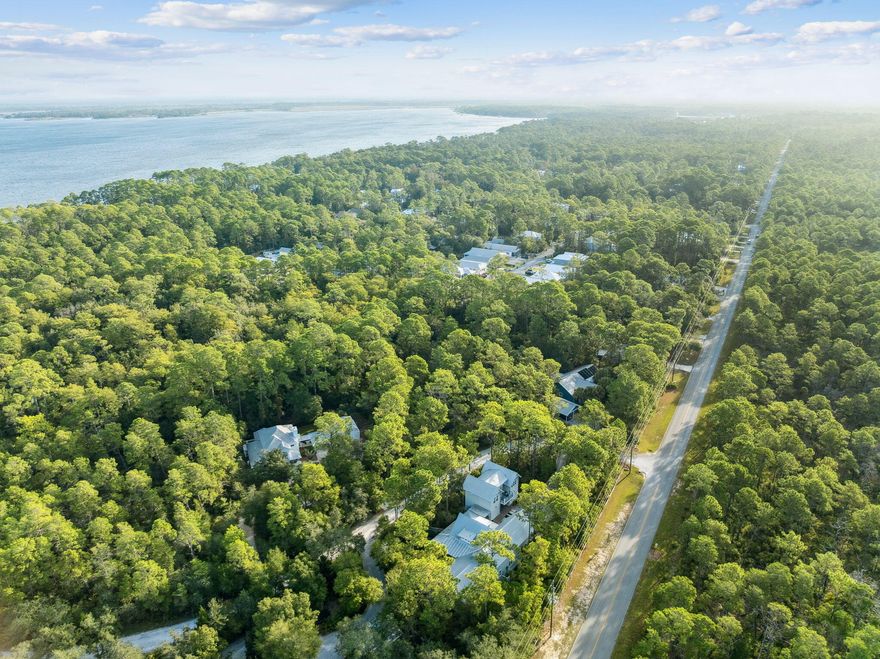 Build your dream home on this spacious 1.12-acre lot in the desirable Bay Magnolia neighborhood of Point Washington. Surrounded by mature trees, this oversized parcel offers privacy and room for outdoor living. Bay Magnolia features a community dock perfect for enjoying sunsets on the Choctawhatchee Bay. Tucked in a quiet setting yet only minutes from Scenic 30A's beaches, dining, and shopping, this homesite blends natural beauty with convenience. Less than two miles to a public boat launch with parking! With no build-out timeframe, you can plan at your own pace. A rare chance to own over an acre in one of Point Washington's most charming communities!