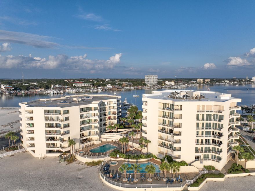 Your coastal investment begins at East Pass Towers! This beautifully updated 2BR/2BA Gulf-front condo offers breathtaking panoramic views of Destin Harbor, East Pass & the Gulf of America. Perfect for watching dolphins play, boats cruise by, and unforgettable sunrises and sunsets from your expansive 300 sq. ft. tiled balcony accessible from the living room, master, and guest bedrooms. Interior upgrades include recessed lighting, granite counters, travertine baths, stainless appliances, solid oak cabinets, freshly painted and a custom laundry area. Enjoy the resort-style amenities of East Pass Towers including a heated pool, hot tub, private beach access, and close proximity to top-rated harbor-side dining, shopping, and entertainment. Whether you're relaxing poolside, fishing, snorkeling off the jetties, or enjoying the vibrant harbor lifestyle via water taxi, this condo offers the perfect blend of comfort, location, and luxury. Located at the exclusive end of Holiday Isle-coastal living at its finest!  Call today to own your piece of paradise!