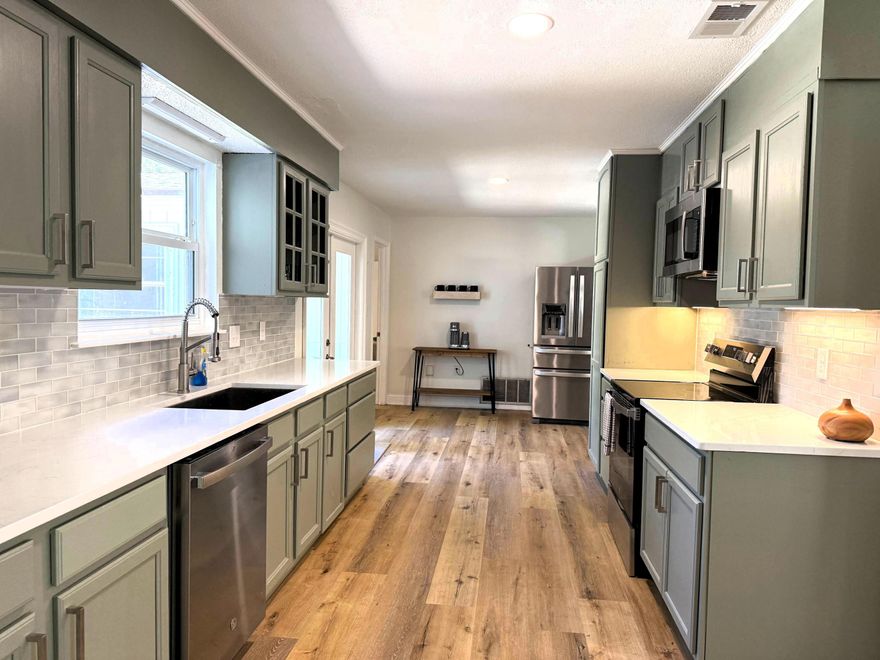 Discover a newly rewired, move-in-ready 3-bed, 2-bath home w/top-to-bottom renovations, including a new roof & modern touches throughout. New flooring & freshly painted interiors create a bright, inviting space that flows seamlessly from the entry to the updated kitchen w/new appliances & stylish fixtures. Bathrooms have been upgraded w/sleek vanities, while comfort features include a new air handler, water heater, & attic insulation for year-round efficiency.Outdoors, the extended driveway leads to a fenced backyard w/an open pad, ideal for a firepit setup. A spacious laundry room adds storage & convenience beyond the noted square footage. Just minutes by golf cart to Fort Walton Beach's vibrant downtown scene, local restaurants, parades, fireworks, & Ferry Park