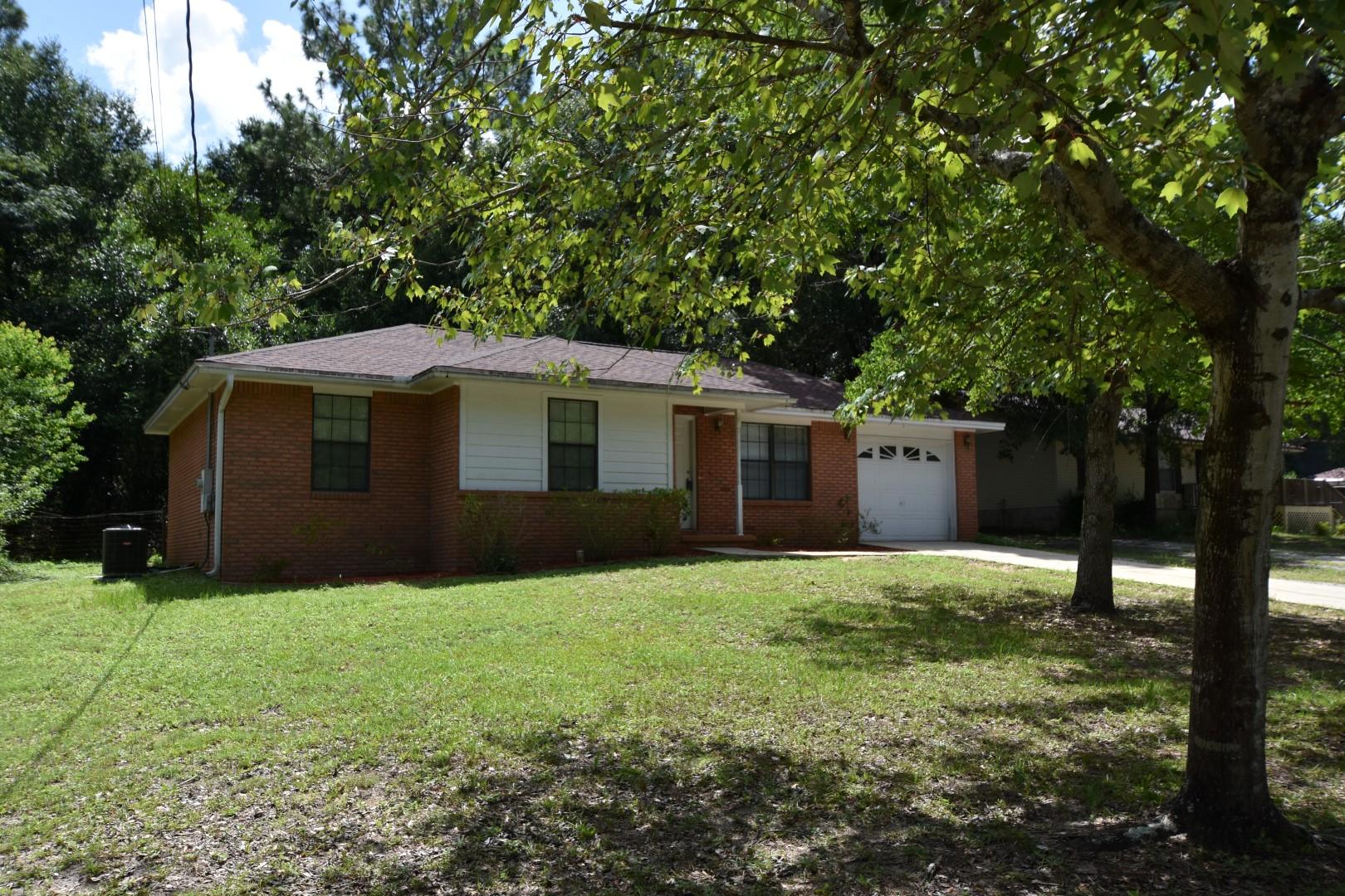 Affordable and like new! New roof shingles, carpet, and vinyl flooring July, 2016. New HVAC system in 2015 (puron). Plus...the seller will pay most closing costs; you pay your 1st year insurance, escrow set-up, credit report, home inspections, and new survey if desired. Existing Survey available. Living Room, Dining Area, and Kitchen give a sense of spaciousness to this home. Kitchen is equipped with Stove, Refrigerator and a large walk-in Pantry. Ceiling fans in the Living Room and 2 Bedrooms. Seller will provide a 1-year Home Warranty: choose between Old Republic and American Home Shield. The wire fenced back yard has a wooded greenbelt from the adjoining lot. Seller will be repairing/replacing bathroom door. This home is in excellent condition so you will want to take a look today