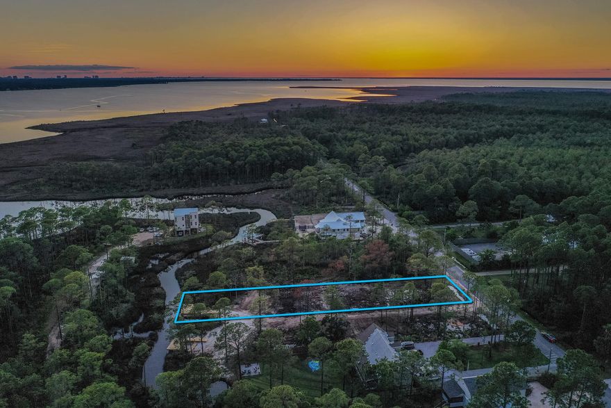 Bring your boat. This canal front lot offers immediate access to the bay. enjoy spacious water front living on this 75x303 foot lot. The lot is build ready with a survey, driveway, culvert installed, brushcut and has a dock. The lot has plans and will allow for a carriage house. No hoa or buildout time. Less than a one minute boat ride to Cesna landing and only a 4 mile ride to the beach. The lots are centrally located between Pier Park and Destin Commons
