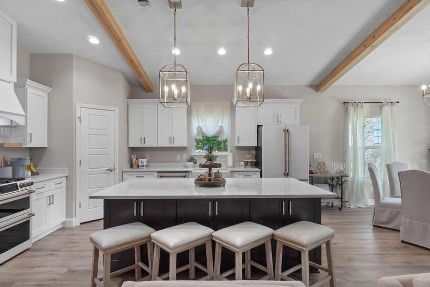 Situated on an oversized lot just under 3/4 of an acre, this brand-new, semi-custom Craftsman-inspired home offers the perfect blend of timeless design and modern luxury. With nearly 2,000 square feet of thoughtfully designed living space, this 4-bedroom, 2.5-bathroom residence provides room to grow, entertain, and enjoy everyday comfort. From the moment you step inside, you'll notice the custom cypress wood beams and soaring vaulted ceilings that create warmth and character throughout. The chef-inspired kitchen is both stylish and functional, featuring tall cabinets, a gas range, and a tankless hot water heater--ensuring endless convenience for the busy modern lifestyle. Your primary suite is designed as a private retreat, complete with a free-standing soaking tub and a beautifully tiled shower, offering a spa-like experience right at home. With the added benefit of a tankless water system, you'll never have to worry about running out of hot water. What truly sets this property apart is the opportunity to make it your own. Choose from a wide variety of flooring options, quartz colors, and cabinet finishes to customize your home to match your stylesomething you won't find in most builder-grade homes. This home is brought to you by a family-owned builder that takes pride in crafting homes with heart. With a focus on quality, integrity, and personalized service, they ensure every detail reflects a commitment to excellence. Bonus: You can even tour this same floor plan in another neighborhood to see the design come to life before making it yours. (Please note: Photos shown are stock images from similar homesactual finishes will vary based on your selections.) Don't miss your chance to own a semi-custom home on a rare, oversized lot in the fast-growing Cantonment area. This is more than just a houseit's a place to create memories for years to come. Estimated completion time is the end of February, 2026.