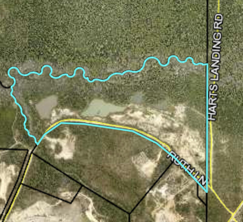 One time it was used as a Sand Pit. To my knowledge the road is partially maintain by the the Air Force.