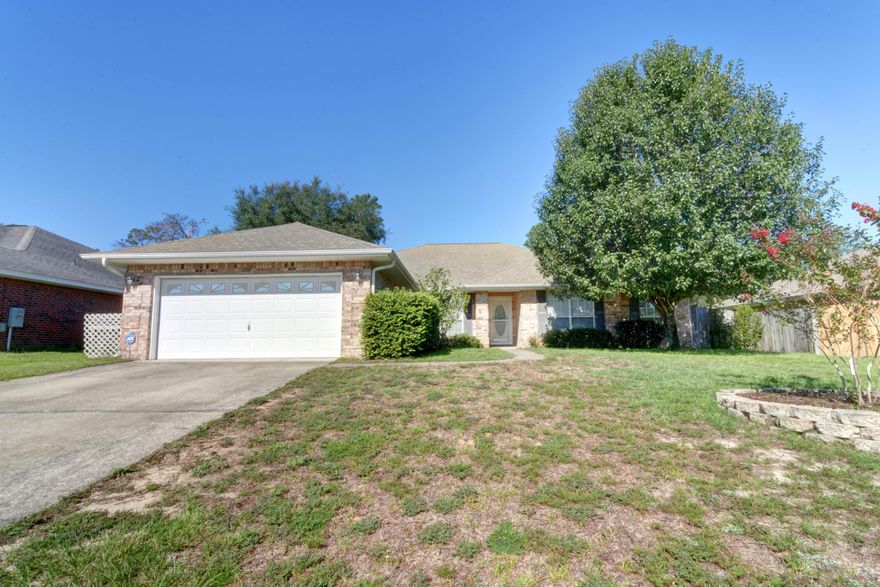 Welcome home to this beautiful and updated 4 bedroom home located in the desirable Waterstone subdivision convenient to Hurlburt AFB, shopping, and the sugar white sand beaches of the Emerald Coast. You'll love the well maintained neighborhood with underground utilities and HOA fees at only $80/year! If you're looking for a spacious home, then look no further, and the mature fruit trees producing peaches is a bonus! With 4 full bedrooms in a great split floor plan layout along with a formal dining room (great for use as a flex room) AND office/den both with hard surface flooring this has all the space you need in just under 2600sqft on a quarter acre lot! This home boasts a huge living area that includes a fireplace, an enormous eat in kitchen, and more cabinet space in the kitchen than