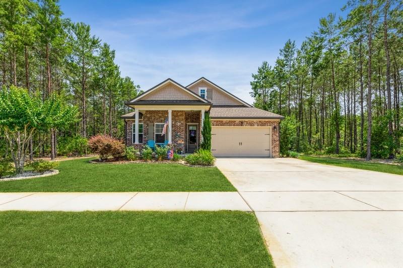 This beautiful all brick craftsman, 3 year young home, has been impeccably maintained. Starting at the adorable front porch you enter the large foyer. The laminate flooring flows throughout the home including the 3 bedrooms and flex space, currently used as an office. The kitchen features the sought after white cabinets, large island, stainless steel appliances and a walk-in pantry. The open concept living space continues from the kitchen into the family room. The private screened in back porch, which overlooks the preserve is perfect for quiet peaceful evenings. The very generous sized master bedroom has room for a sitting area and includes his and hers walk-in closets. The master bath has both a shower and soaking tub, double sinks and linen closet. This home is ready for its new owner. Hammock Bay is a golf cart friendly community with sidewalks, nature trails, and bike paths. The Lake Club at Hammock Bay includes a lap pool, two resort style swimming pools, lighted basketball courts, pickle ball, meeting facilities, caterer's kitchen and 6000ft club house with a movie theater. Adjacent to the Lake Club is the state of the art fitness center with Master Weight equipment and much more. For the dog lover there is the Canine Commons doggy park. The Green is home to concerts, bimonthly farmers markets and community events.The community also houses the 60-acres Sports Park with ballfields, splash pad, lighted tennis courts, disc golf course and much more called the Freeport Sports Complex.