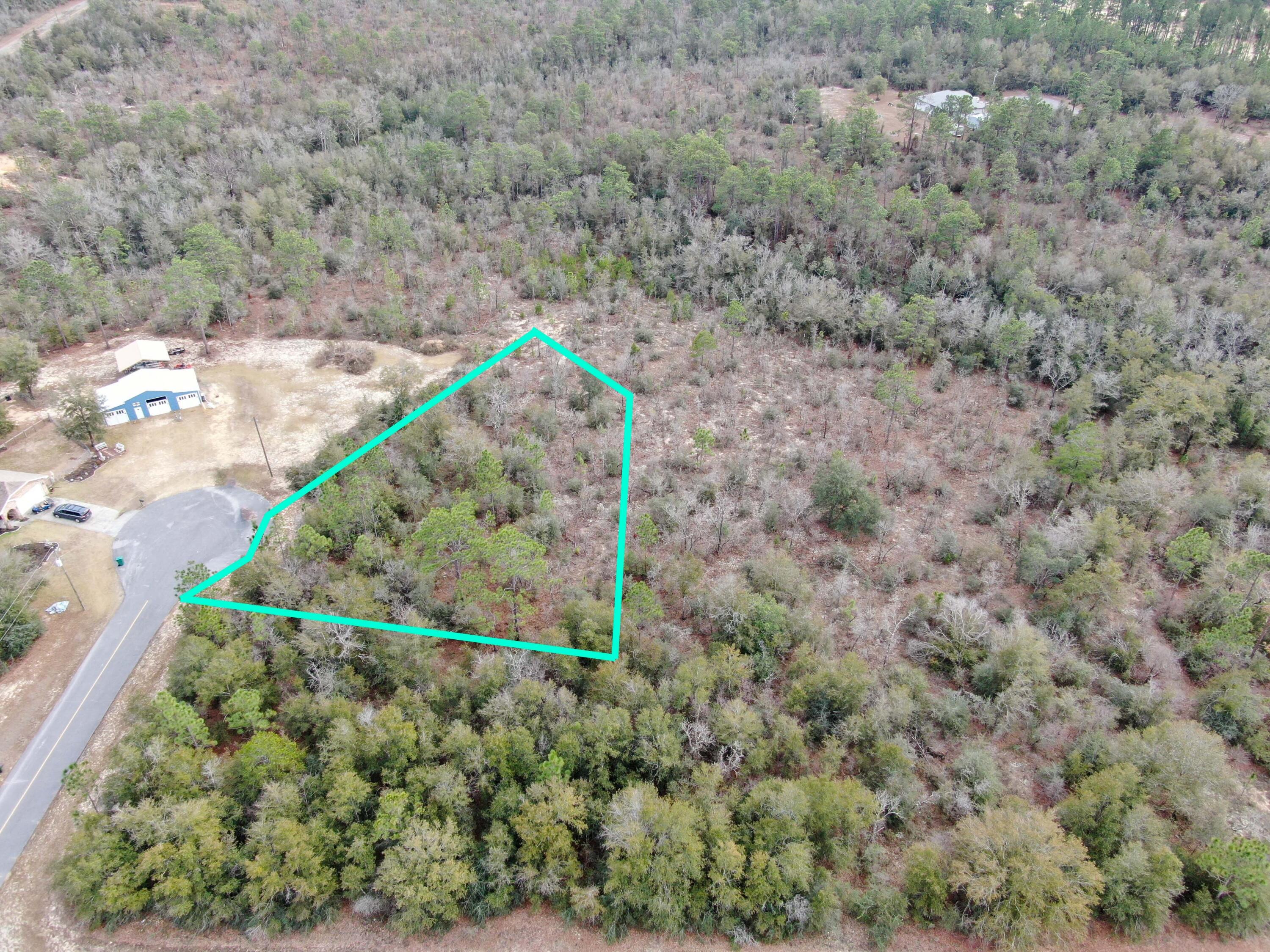 Very nice, large, cul-de-sac lot. Paved road access. Across the street from the Golf Course Clubhouse. Backs up to 1400 acres owned by the original developer, Deltona, and Gap Lake. See plat map in photos. If you're looking for a country feel with paved roads easy access, - Then take a look at Sunny Hills!!! Sunny Hills is located 25 miles north of Panama City and 18 miles south of Chipley. This deed restricted, paved road, community offers a popular 18 hole public golf course and numerous great fishing lakes. Great community feel! Check it out today!!