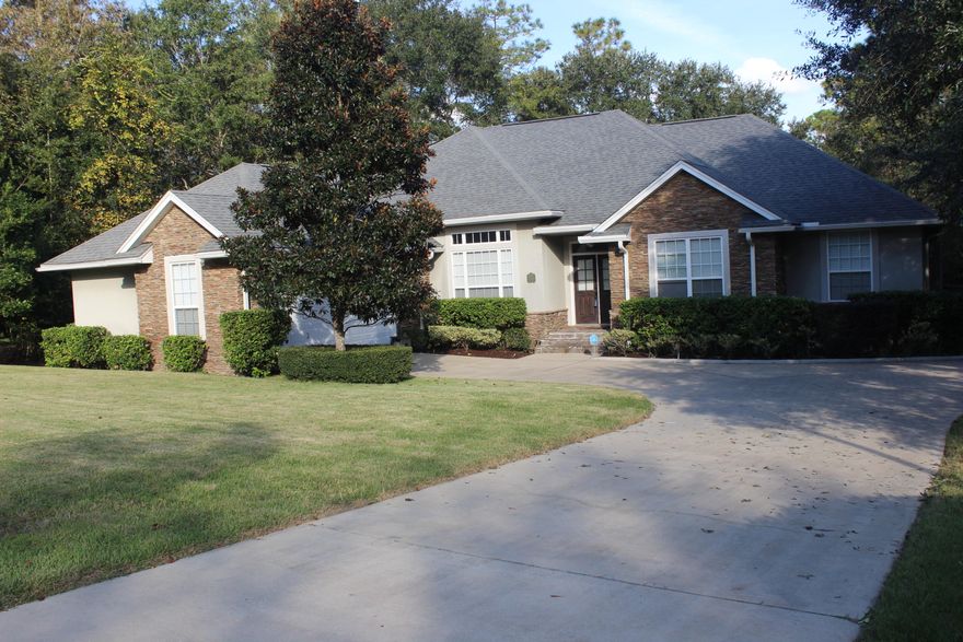 South Crestview, the best location to the bases, shopping, restaurants, and entertainment. This well built home is built by one of our upscale Destin builders offering many features. Freshly painted this open living with split floor plan home features: high ceilings, tray ceilings, crown molding, large rooms, tile , and hardwood flooring in the dining room and foyer. The large gourmet kitchen features a gas oven, granite counters, custom cabinets, pantry, center island and breakfast nook. The living room features a tile surround gas fireplace, and tray ceiling that leads to a huge screened in porch with a wooded view in the back yard. The master suite features a sitting area, tray ceiling, huge closet, double vanity, jetted tub, and separate shower. Large laundry room with sink .