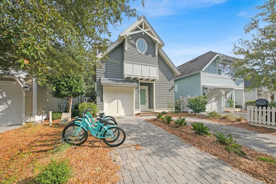 This quintessential beach cottage in WaterSound West Beach boasts three beds, four-and-a-half baths and lots of hidden extras. Fully furnished, it's designed to comfortably accommodate 14 guests. Completed in 2020 to a design by R.W. Lowe Architecture, this attractive coastal retreat was built to the highest standards by Ryan Harp Construction. With two primary suites, a bunk area and a fun-filled game arcade on the second floor, it's ideal as a full-time residence or as a vacation home with rental potential. Leave your vehicles on the twin parking pads and head inside. The open floor plan is designed for seamless indoor/outdoor living, whether you're enjoying a peaceful break or entertaining family and friends. Bathed in natural light, the spacious living area has designated areas for cooking, dining and relaxing. Shiplap walls, airy 10-foot ceilings and gorgeous wood flooring enhance this attractive space, all lit by designer lighting. The pristine white kitchen is very much a part of the social space, with an expansive quartz-topped breakfast bar. Five stools invite social conversation over long, cool drinks and tasty snacks. This well-appointed space has ample storage, KitchenAid professional appliances and a generous six-burner stove beneath an oversized hood. Beyond the sitting area, French doors open onto a sunny screened porch. It's a place for relaxing and enjoying the peaceful, sun-dappled views of the preserved woodland. Imagine breakfast outdoors accompanied by the sound of birdsong as you plan the day's activities. Return in the evening for sunset cocktails after rinsing off sandy feet under the outdoor shower. The cottage includes a first-floor master suite for living all on one level, if required. Four built-in bunks make good use of the flex space on the second-floor landing, and there's still room for a comfy sofa and a wall-mounted TV. The adjoining bathroom with artisan tile adds another practical touch. Tucked around the corner, the gaming arcade is sure to be popular with kids of all ages. The second-floor master suite also makes good use of space with a king-sized bed, a reading area and additional space for a desk. Beneath the sloping eaves, the third bedroom is furnished with two queen beds. Another pristine ensuite bathroom provides private facilities for visiting guests. This serene coastal retreat includes a garage which can house your golf cart for getting around. Feel the breeze in your hair as you explore winding boardwalks lined with mature pines, play golf or visit the beautiful beach, all within this exclusive gated community. Residents and guests can also enjoy the heated resort-style community pool with shady cabanas, outdoor grills and a cozy fire pit for toasting s'mores.