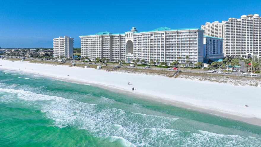 Stunning panoramic Gulf views are the hallmark of this one-bedroom, two-bath unit. The open kitchen, dining, and living area feature mesmerizing views of the Gulf. The bedroom suite is located in the north end of the unit and comfortably contains a king bed and en suite bath. Hall bunks and a full guest bath allow for additional sleeping arrangements. Glass sliders lead you to the spacious balcony where you can enjoy breathtaking views from sunrise to sunset and let the salty breeze wash over you. With serene coastal finishings and design, this paradise will quickly become your favorite place to unwind! Majestic Sun is a beautiful condo known for the giant archway that connects two buildings of Gulf front units. It is part of popular Seascape Resort offering owners and guests spectacular amenities including a heated indoor/outdoor pool, two whirlpool hot tubs, fitness center, 18-hole championship golf course, tennis courts, nature trail, fresh water lakes, beachside bar and grill, covered parking, Towne Center with shopping, restaurants, and family-fun, and 2,000 feet of gorgeous beachfront!