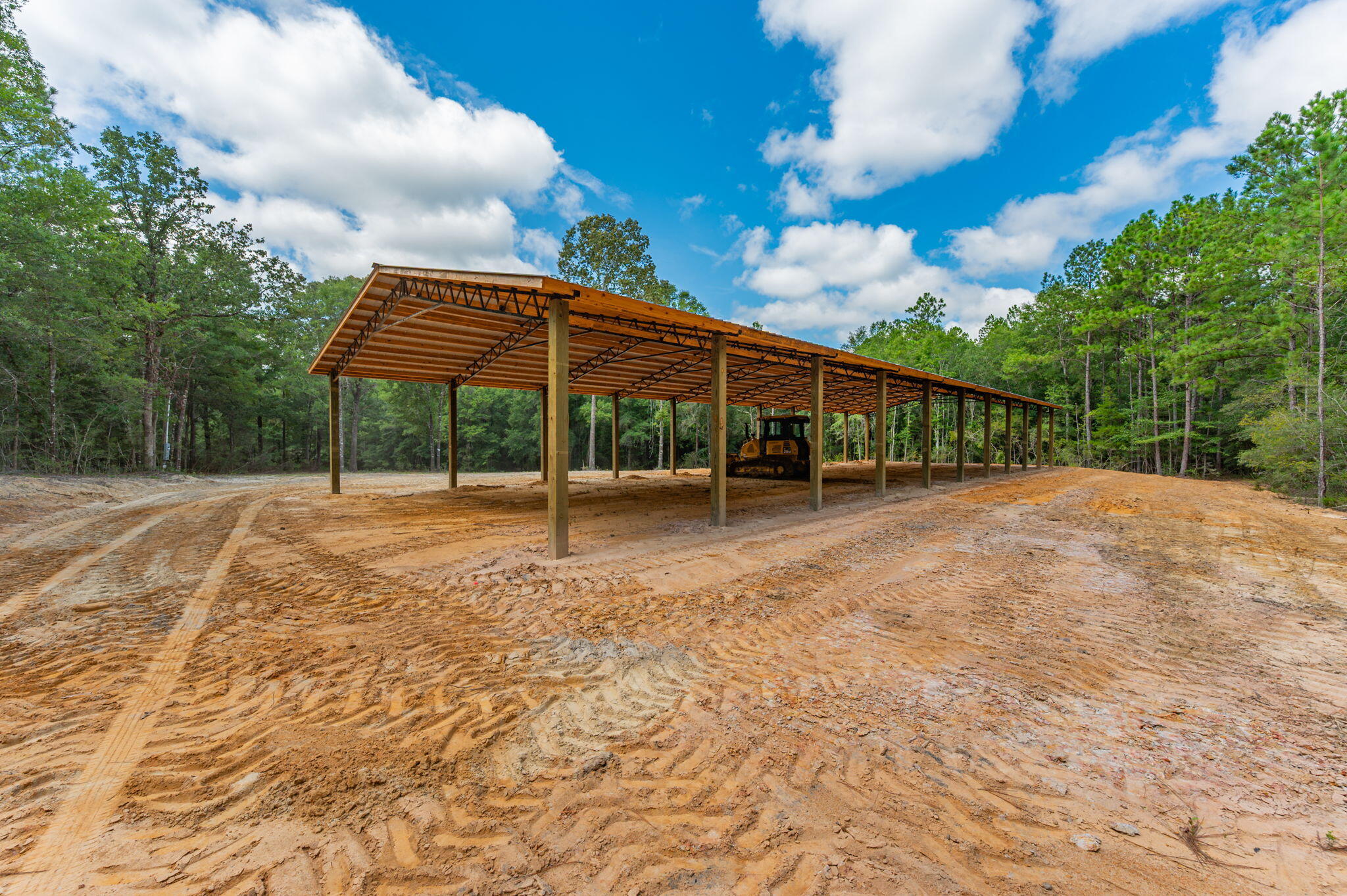 Perfect place to build your dream home - this 30 acres located just outside of Florala on Union Rd offers everything to call home! Convenient access to Crestview and Eglin Air Force Base. Property includes mature pines providing natural privacy with tons of lanes cuts in for hunting along the paved road frontage. This property offers dream hunting, opportunity to clear and raise cattle, horses, or other livestock. Property comes ready with mulched roads leading to each corner. Brand-new 40x120 pole barn features sturdy construction with 8x8 posts and 12 ft eaves for all your storage needs. Power pole and well are already in place, making it easy to call home quick. Property connects to a private hunting camp allowing even more privacy and is just minutes to the river perfect for fishing!