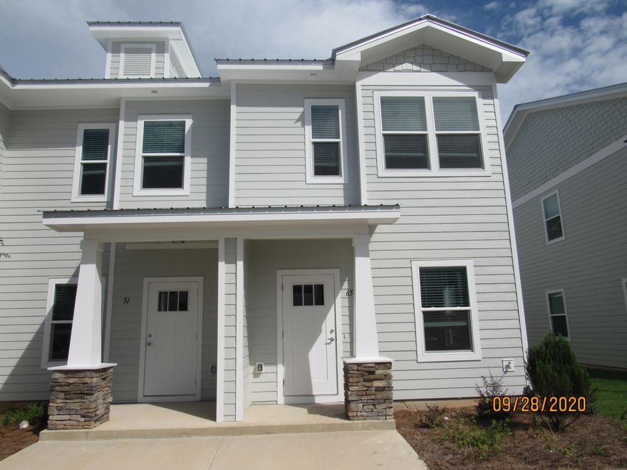 This 3 bedroom, 2.5 bath end unit town home with upgrades and a community pool! This lovely home is across the street from an elementary school, just down the road from a Publix shopping center, and a short, easy commute to the sugar sand beaches and emerald waters of 30a/SOWAL. It has fresh, neutral paint and no carpet throughout. The open floor plan on the first level includes a nice size living room with nook, eat-in kitchen with breakfast bar, gorgeous counter tops, plenty of counter/cabinet space, stainless appliances (including a flat cook top stove), and a beautiful back splash, as well as a half guest bath with pedestal sink and a screened-in back porch