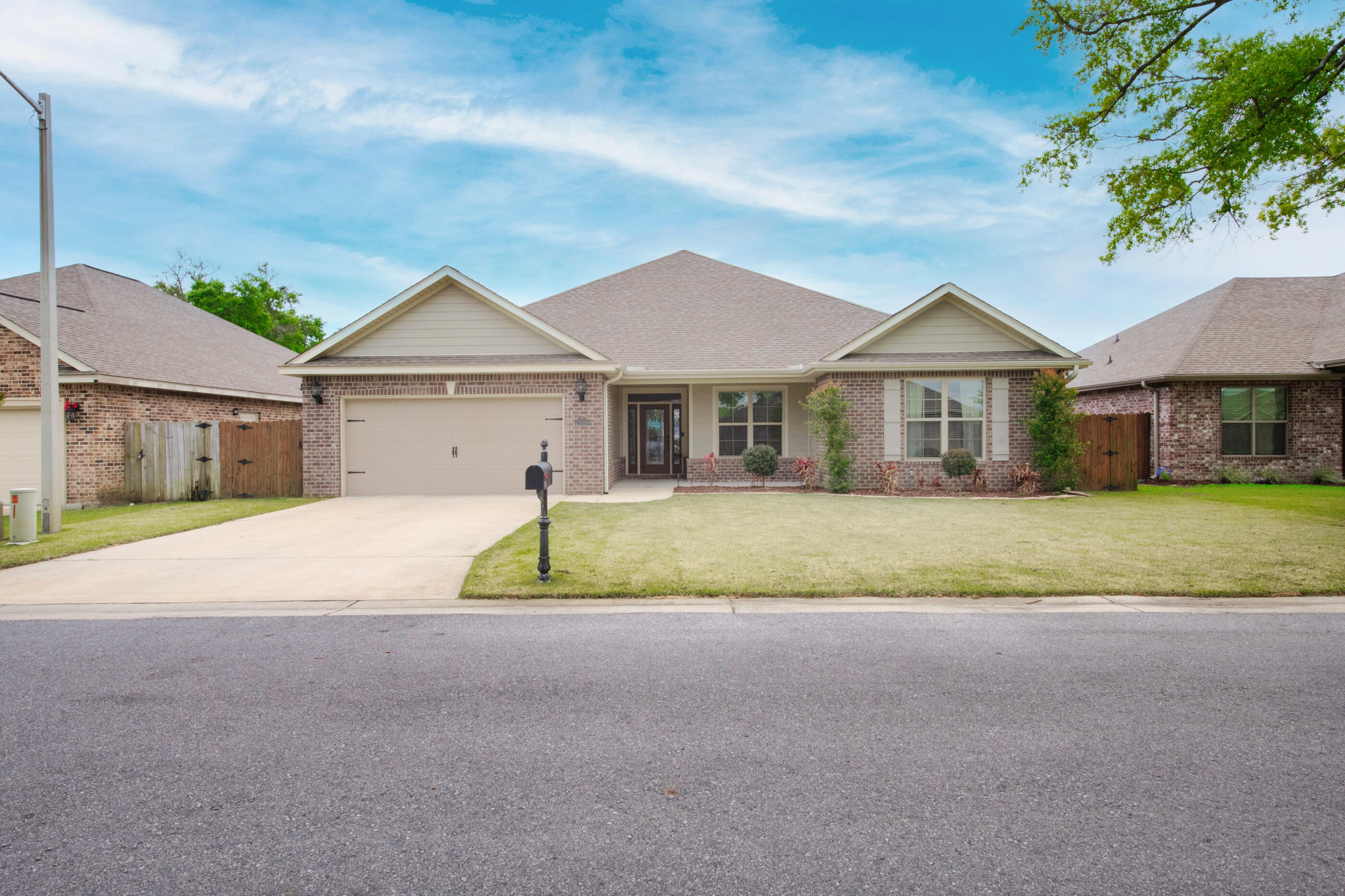 Beautiful 4 bedroom 2.5 bath home built in 2016! This large open floorpan has granite countertops, stainless steel appliances, breakfast bar, and plenty of room for entertaining. The master bathroom has a large walk in closet, double vanity, and large soaking tub. Additional features include covered patio with fenced in yard, custom woodwork, large bedrooms, ring camera, tray ceilings with LED lights, new paint throughout and epoxy garage floors.Conveniently located near Hurlburt Field and Eglin AFB. Schedule your showing today!