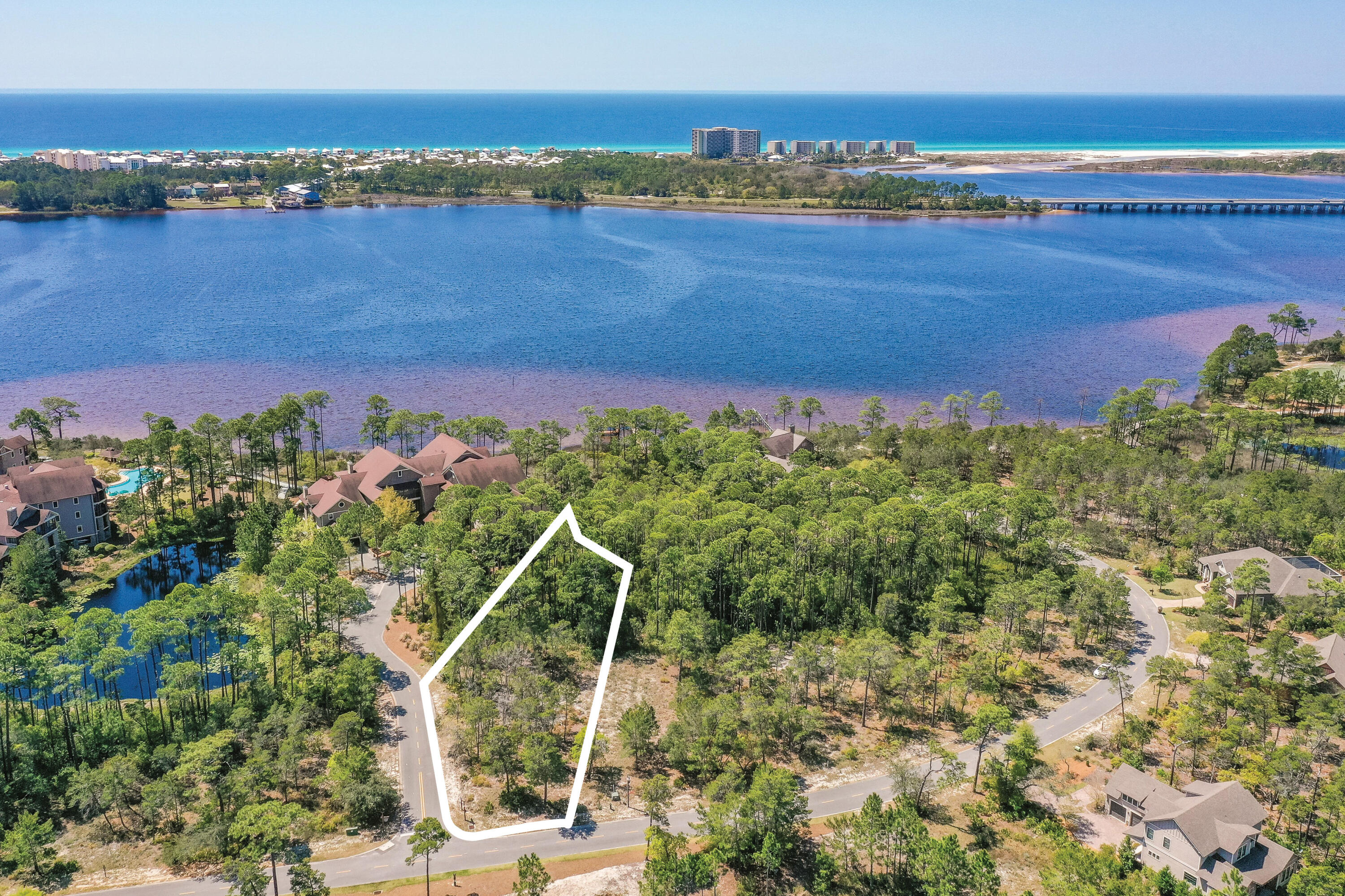 Build your dream home on this spacious .47 acre home site, close to all the amenities, in the beautiful gated community of Wild Heron, 734-acre Coastal Sanctuary, located on the shores of Lake Powell. This beautiful corner lot backs to a conservation area and borders two streets allowing for more architectural opportunities. It is just a 3 min. walk or short bike ride to all the amenities on Lake Powell where you can kayak or paddle board to the World's Most Beautiful Beaches. Enjoy living on the quiet west end of Panama City Beach, with just a quick drive east to Pier Park or west over the bridge to 30A. Wild Heron is known for its world-class amenities including a lake view swimming pool, health & fitness center, ring fire pit, lakeside boardwalk and a revered oak-filled family park that features many types of fun filled family events. The lakefront boathouse and gathering place is well stocked with kayaks and canoes. A series of boardwalks and 24 miles of bike paths link the amenities for the convenience of all who call it home. Wild Heron is also the proud home of the Greg Norman designed Sharks Tooth Golf Course and hydro court tennis courts and can be enjoyed with a membership. Just minutes from world class shopping, dining, entertainment, 30A and the Beaches of South Walton, makes this home site an ideal location. Buyer should verify all data and approximate dimensions. Call today for a viewing.