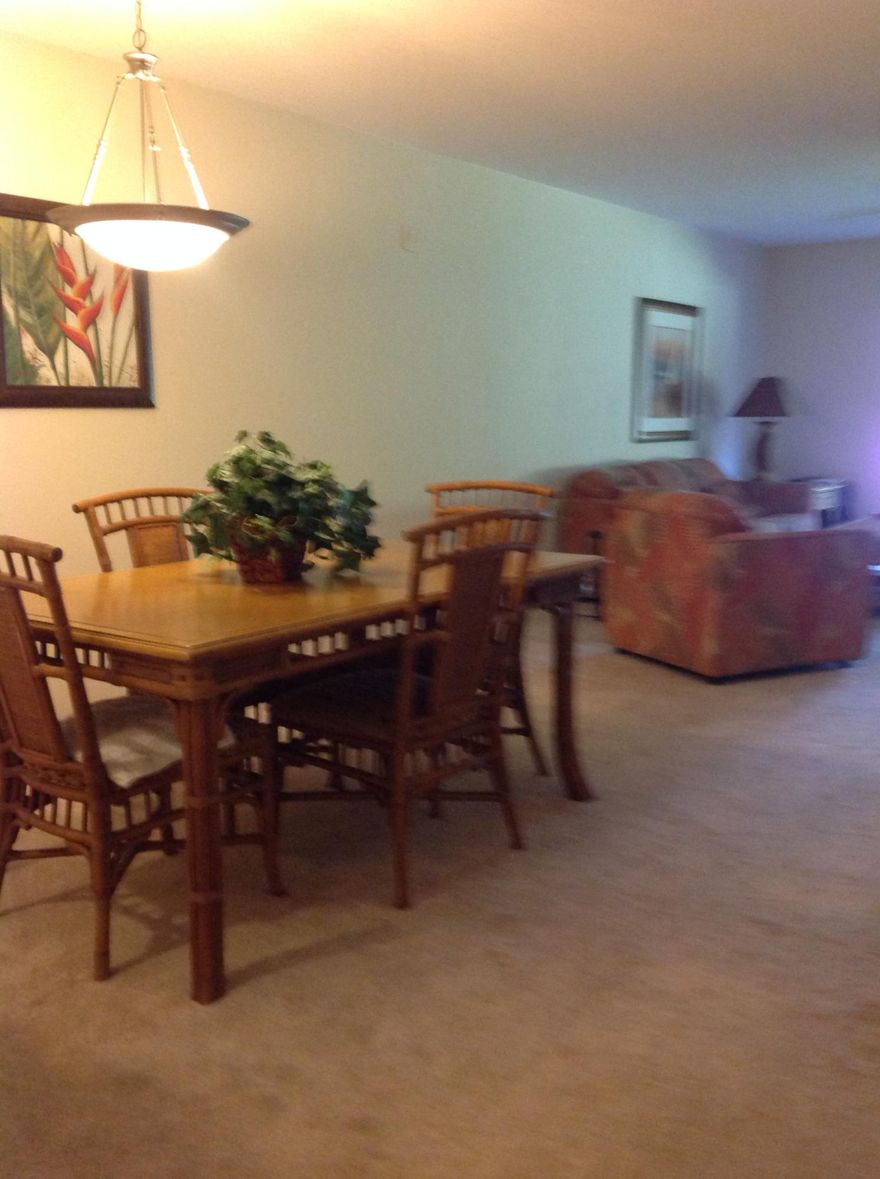 Live in sunny Florida Club with pool,, hot tub, sauna & work out room. Beautiful new granite just added to the kitchen. Carpeting less than 1 year new. This 2bedroom, 2 full bath unit is one of 4, 1198sf, that are 230sf larger that standard 2/2 models, double wide balcony with dual access from both Living room & Master bedroom sliders add to the sunny unit. Ground floor location allows direct walk out to lush grass area from the screened patio which also boasts 2 storage closets. Both bedrooms have walk in closets. Condo has full size washer/dryer in the unit & is offered completely furnished & stocked for rental program, if you like.