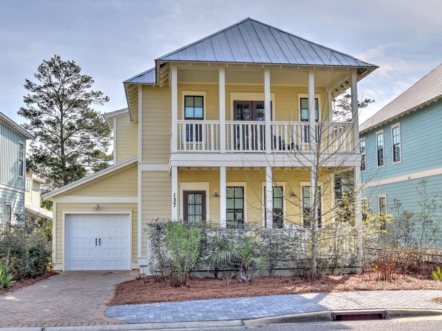 Take advantage of this beautiful home in quiet Lakeside at Blue Mountain! Three bedrooms and has bonus room for office or bunk. One of the lowest priced home in the neighborhood! All hardwood floors and designer tile and lighting with stainless kitchen and granite countertops. Front porch allows for lazy days of reading or catching the sea breeze. Attached garage with concrete pavers. Close to Blue Mountain Beach Access. This one won't last long! Blue Mountain Beach boasts great restaurants, shopping and beach access.