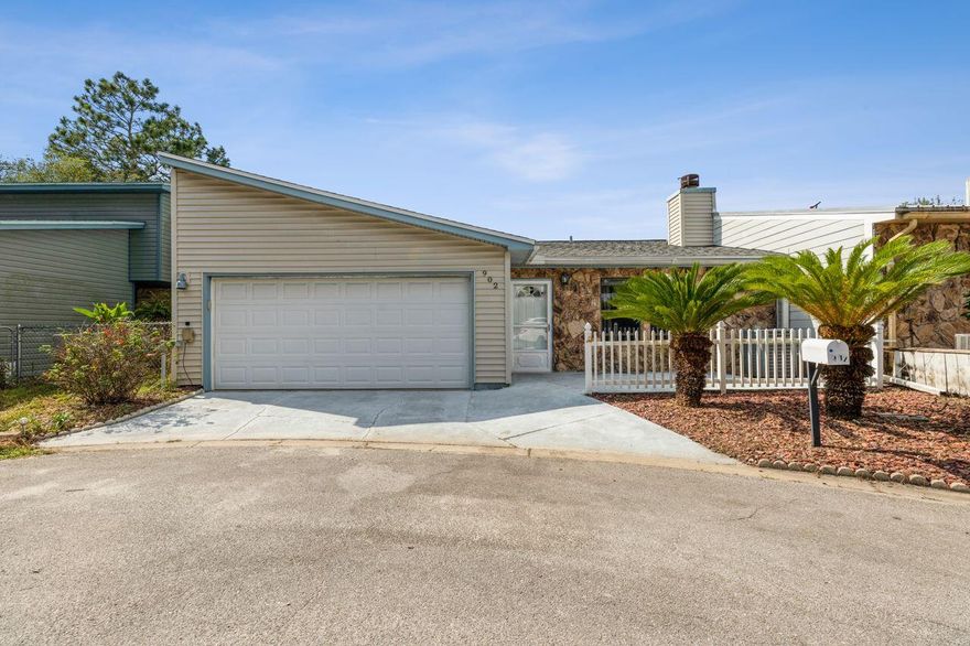 This spacious 2BR/2BA unit packs a big punch--the primary bedroom is almost as large as the 2-car garage & the location is phenomenal!  Less than 5 minutes to Fort Walton Beach Medical Center and medical office parks, beaches, bases & touristy places!  New roof January 2021...Water Heater 2020...Guest bath features a walk-in tub...private, covered deck...ceiling fans!  Renovated Master Bath features large, tiled shower-stall & counter-height vanity!  Both bedrooms include access to the covered deck & both have fabulous walk-in closets!  Focal points of the Living Room include built-in shelving & fireplace (electric).  Maintenance-free yard!