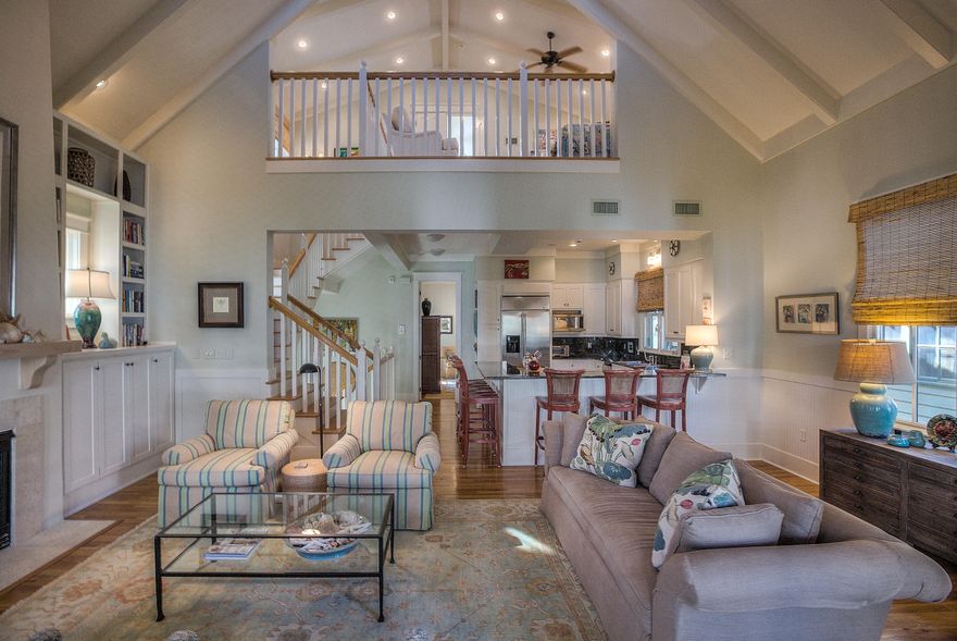 Located just steps from the TOWN CENTER and WHITE SAND BEACHES of the Emerald Coast this Caribbean style home brings the best of Island living to ROSEMARY BEACH. With amazing GULF VIEWS from the large covered second floor balcony and perfect location along the tree-lined boardwalk to the beach, this home is the perfect place to relax the days away. It exudes curb appeal with two front porches lining the BOARDWALK TO THE BEACH, large open back patio with room for a private pool, and the side entry front door with two story foyer! The exquisite charm of this home is found in the architectural details- from the vaulted ceilings finished with wood beams and cross bars to the beautiful stucco exterior and Bahamian shutters. Once inside you will find the an oversized Master Suite with