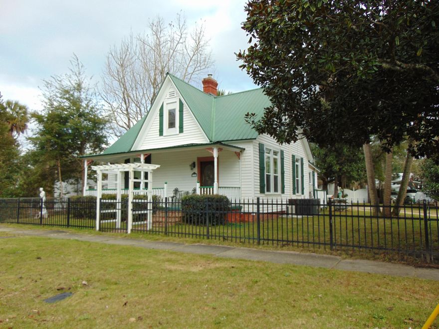 Affordable Victorian home in historic district & 1 block from Lake Defuniak. All the charm of an historic home, w/ all the modern amenities. Metal roof '05; ext. window frames metal wrapped; tankless hot water heater, new HVAC & duct work, double-pane argon-filled windows (double-hung for easy clean)...all in '15. Spacious eat-in kitchen w/lots of pantry space, granite countertops. Beautiful stain glass double doors separate kitchen & formal dining. Fireplace in living room & master BR. Ext. features include 7x26 porch w/concrete floor; 16x24 back deck w/ built-in bar, awning; recessed lighting w/ dimmer built into back soffits. Fenced on 3 sides w/over 100' high-quality aluminum fence & double gate across front & privacy fence at back. Seller is licensed agent selling personal residence.