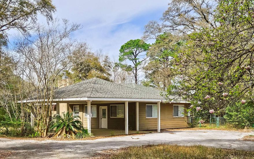 Great location and a large 2.5 + acre lot - Large 3 bedroom and 2 bath brick home with good bones that will require some work to make it shine again  -  inground pool that will need to be brought back to life -  Large  workshop/carport /warehouse building with many uses - No HOA - No covenants - County Zoning.